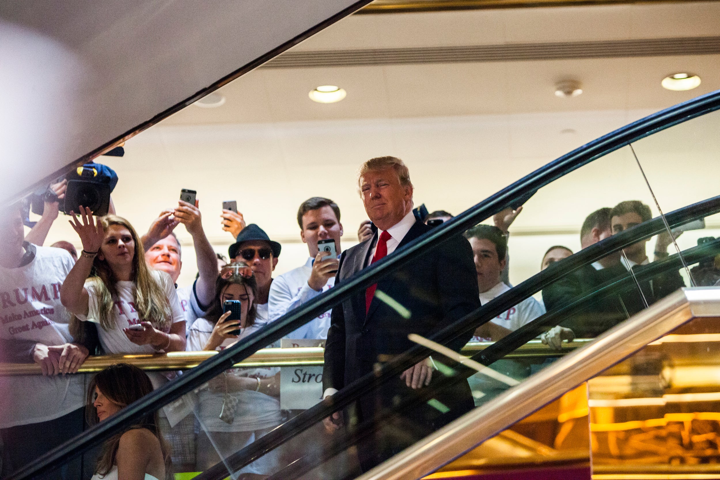 Donald Trump, seen here descending Trump Tower's so-called golden escalator, is now being sued over an injury allegedly caused by the moving staircase made infamous when he used it to announce his 2016 presidential run