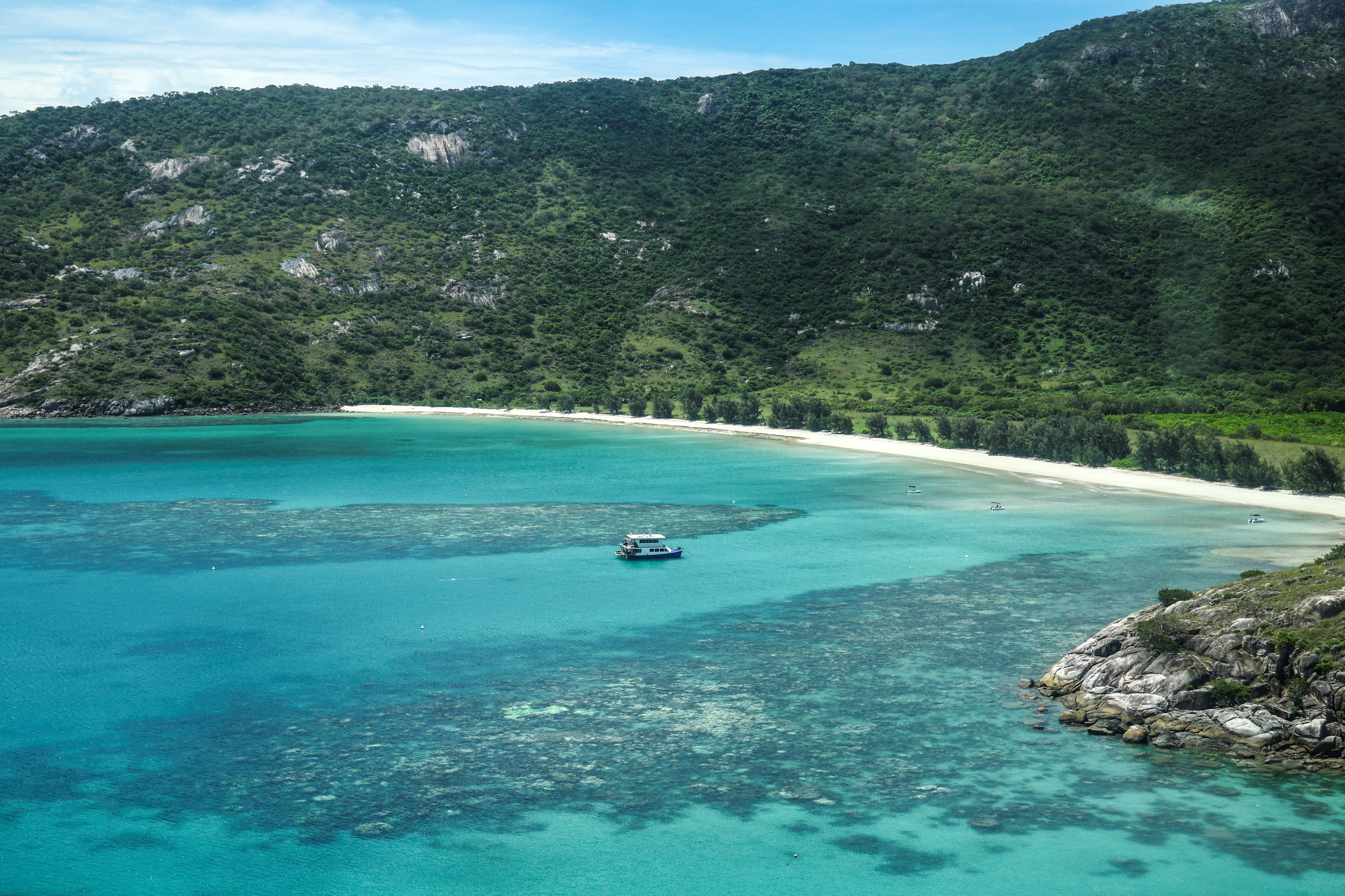 This aerial photo taken on April 4, 2024, shows a boat anchored near coral around Lizard Island on the Great Barrier Reef, located 270 kilometres (167 miles) north of the city of Cairns