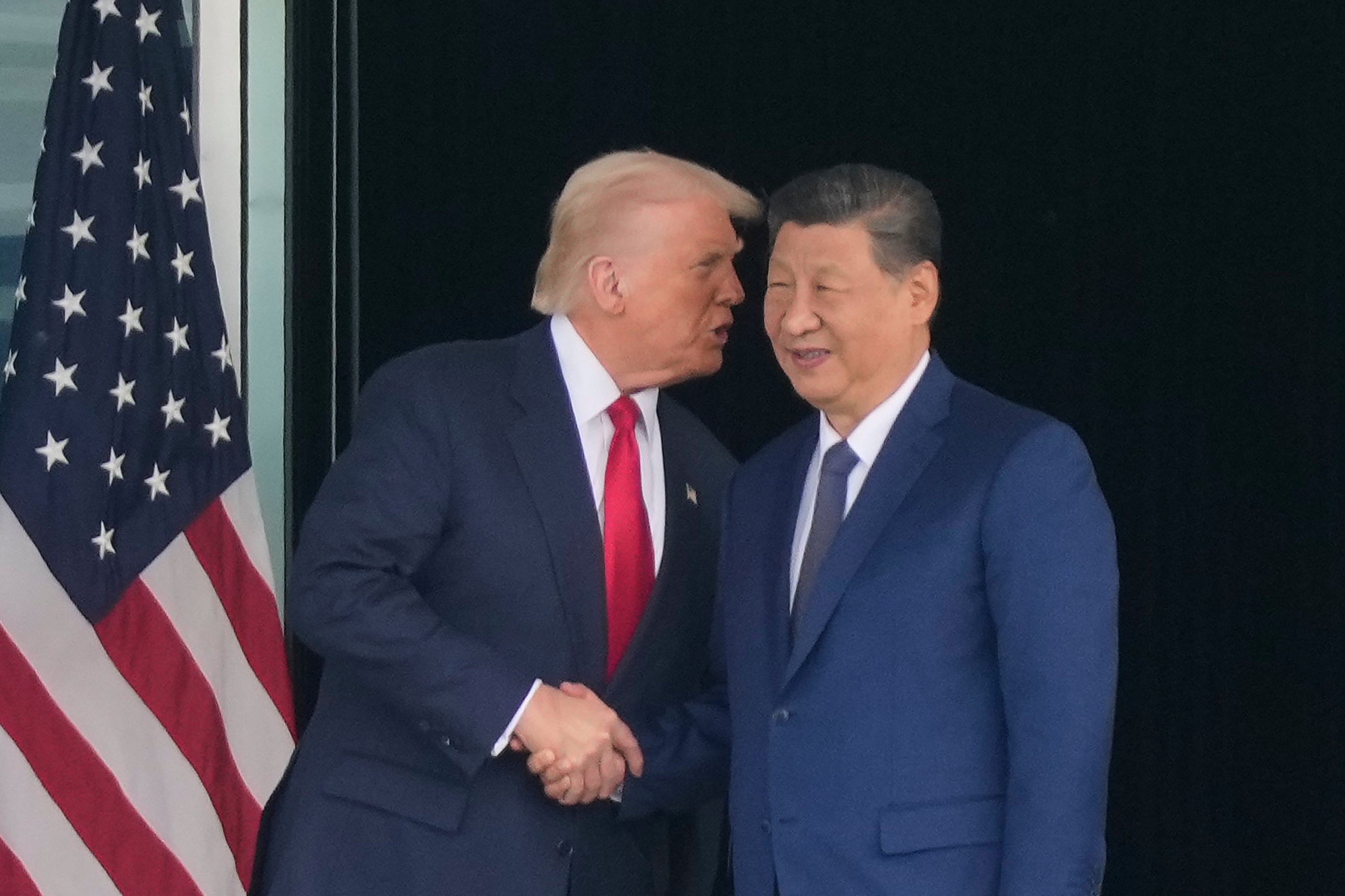 US president Donald Trump and Chinese president Xi Jinping shake hands after their summit meeting in Busan
