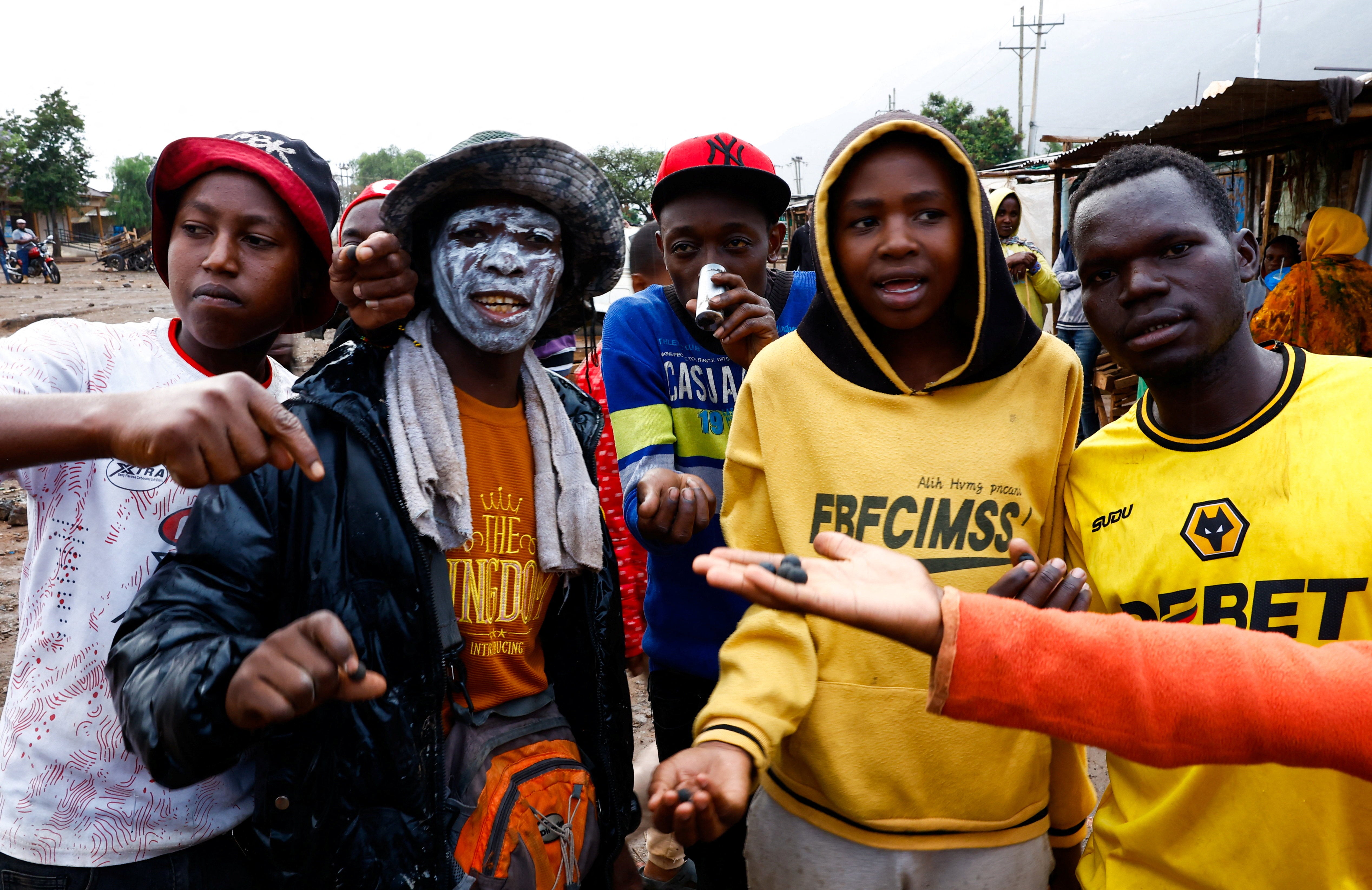 Residents hold rubber bullets and used teargas canisters at the Namanga One-Post Border crossing point between Kenya and Tanzania.