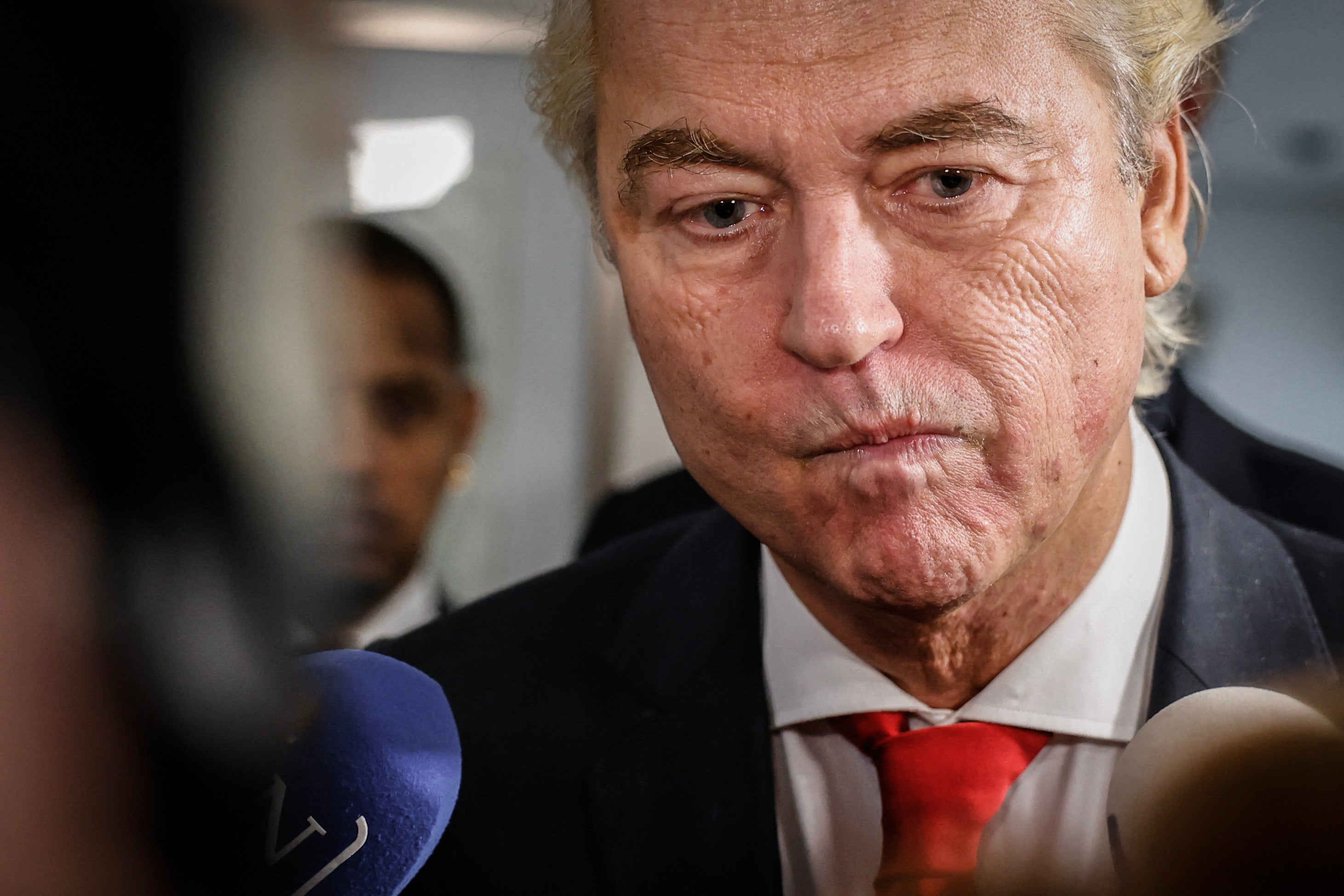 Geert Wilders reacts as he delivers remarks to journalists the day after the Dutch parliamentary election vote.