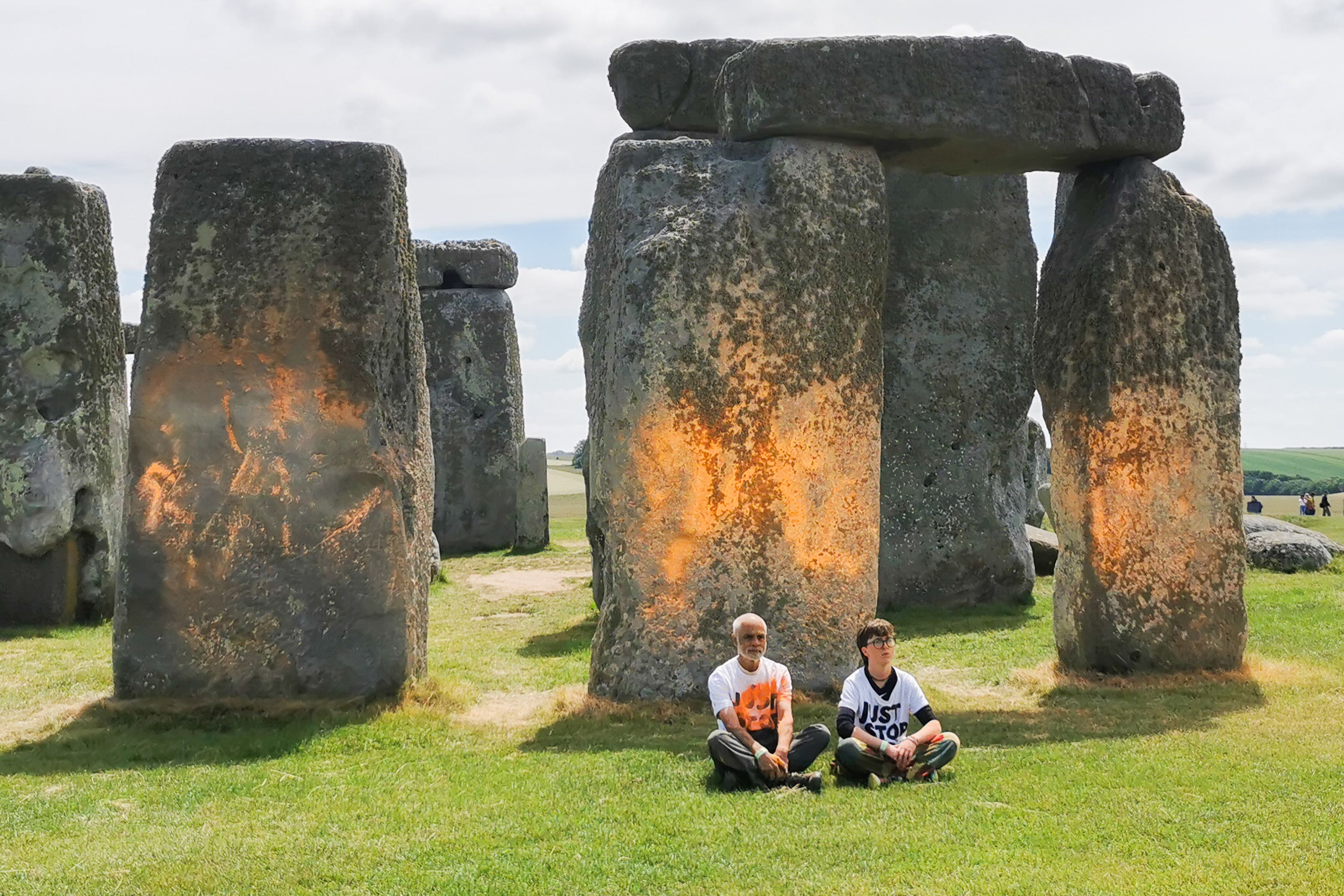 Just Stop Oil protesters sit down after an orange substance was sprayed on Stonehenge