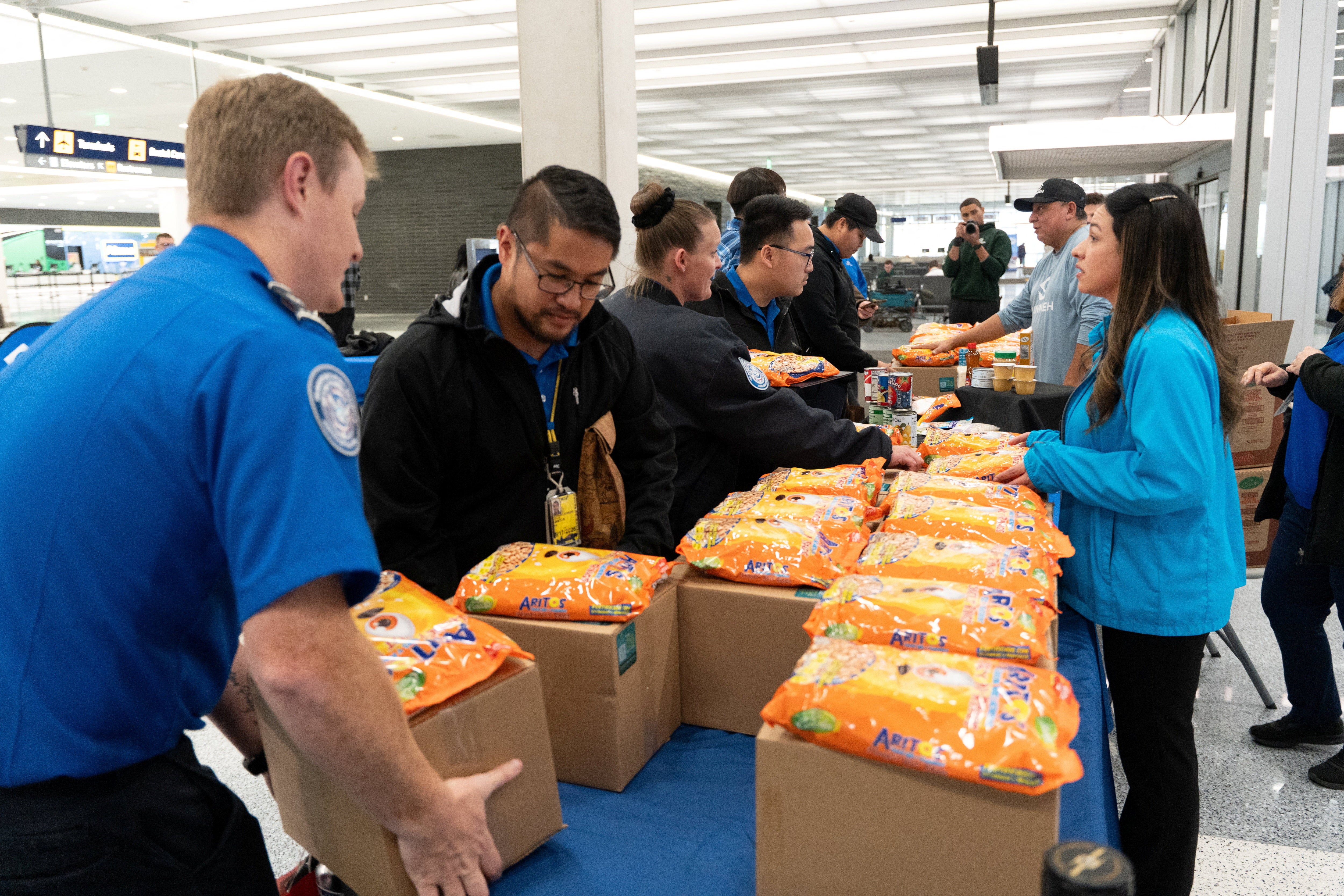 Major airlines and food banks are helping feed essential federal workers at the nation’s airports, including TSA employees and air traffic controllers, who are working without paychecks