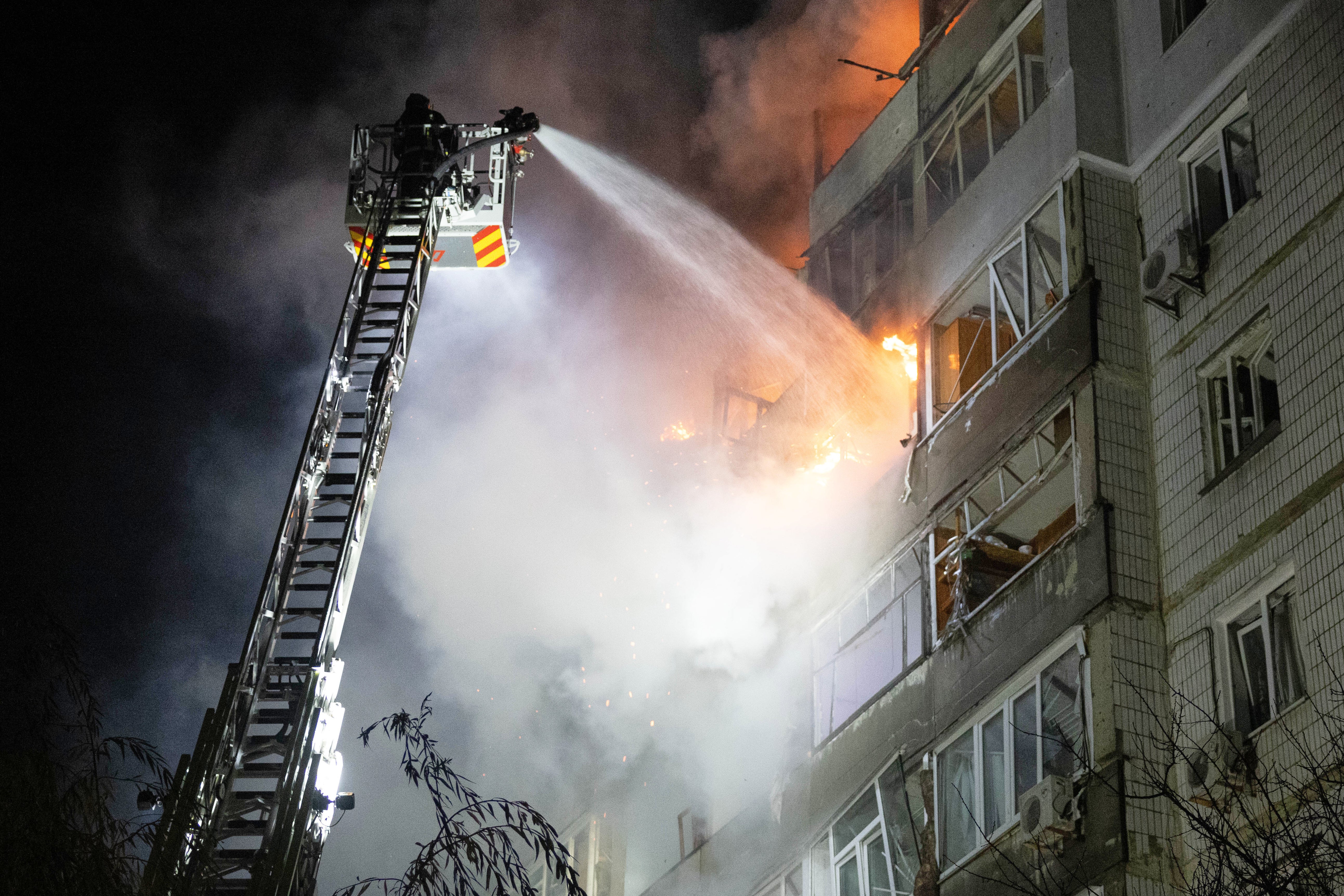 Emergency personnel work to extinguish a fire in Sumy, Ukraine