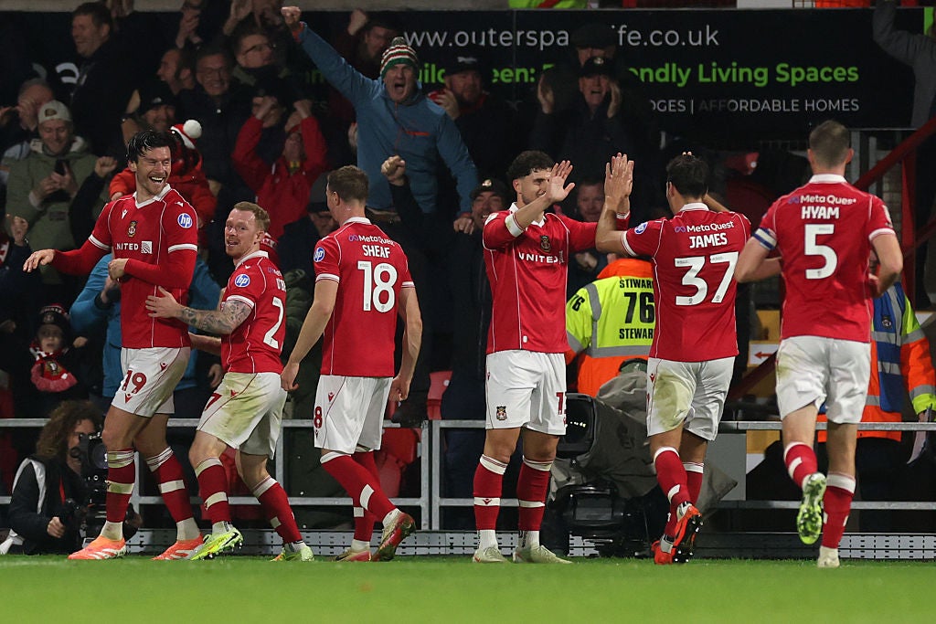 Wrexham beat the Championship leaders to move up to 11th