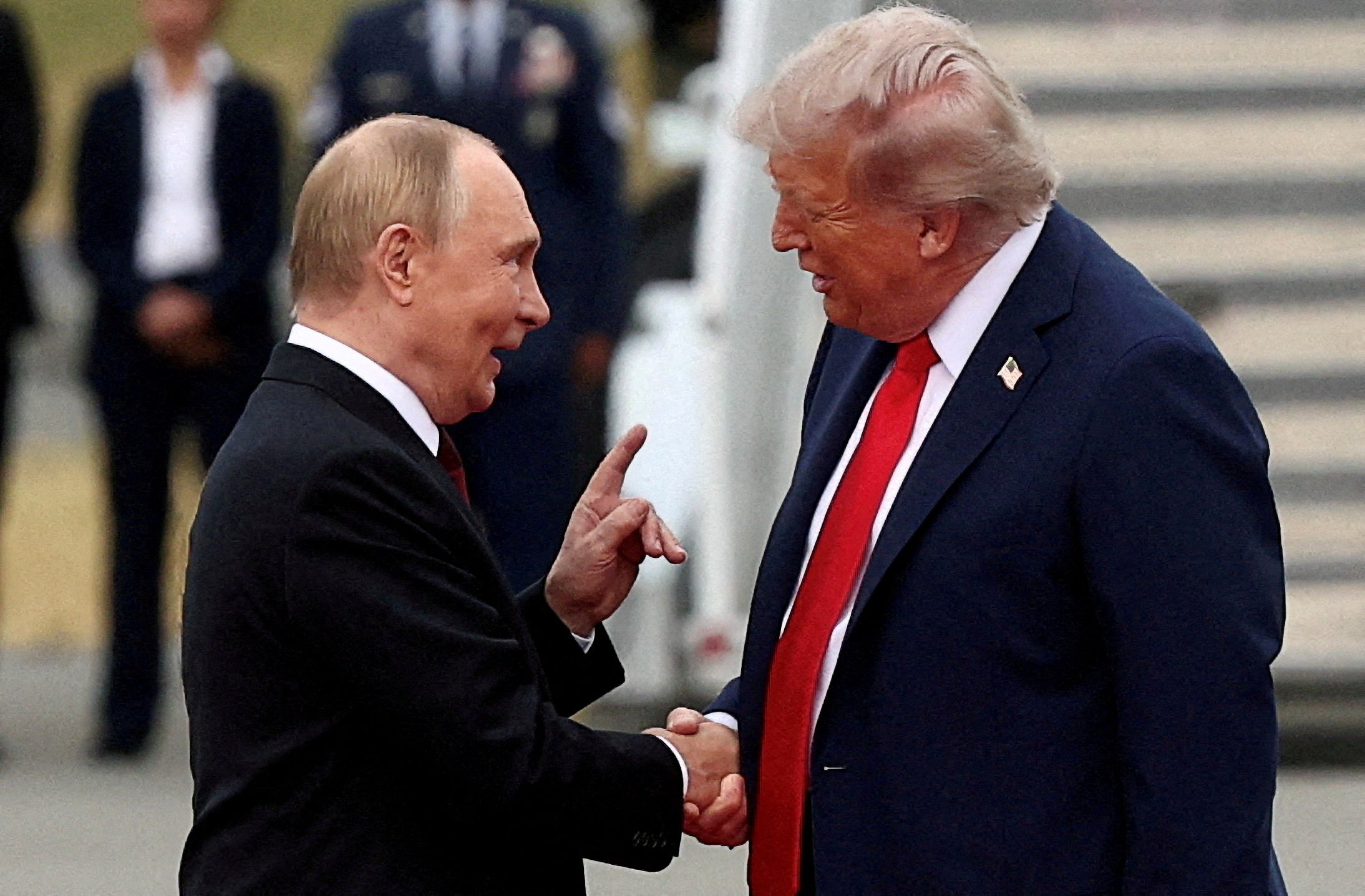 Trump shakes hands with Russian president Vladimir Putin, as they meet to negotiate for an end to the war in Ukraine in Anchorage, Alaska, in August