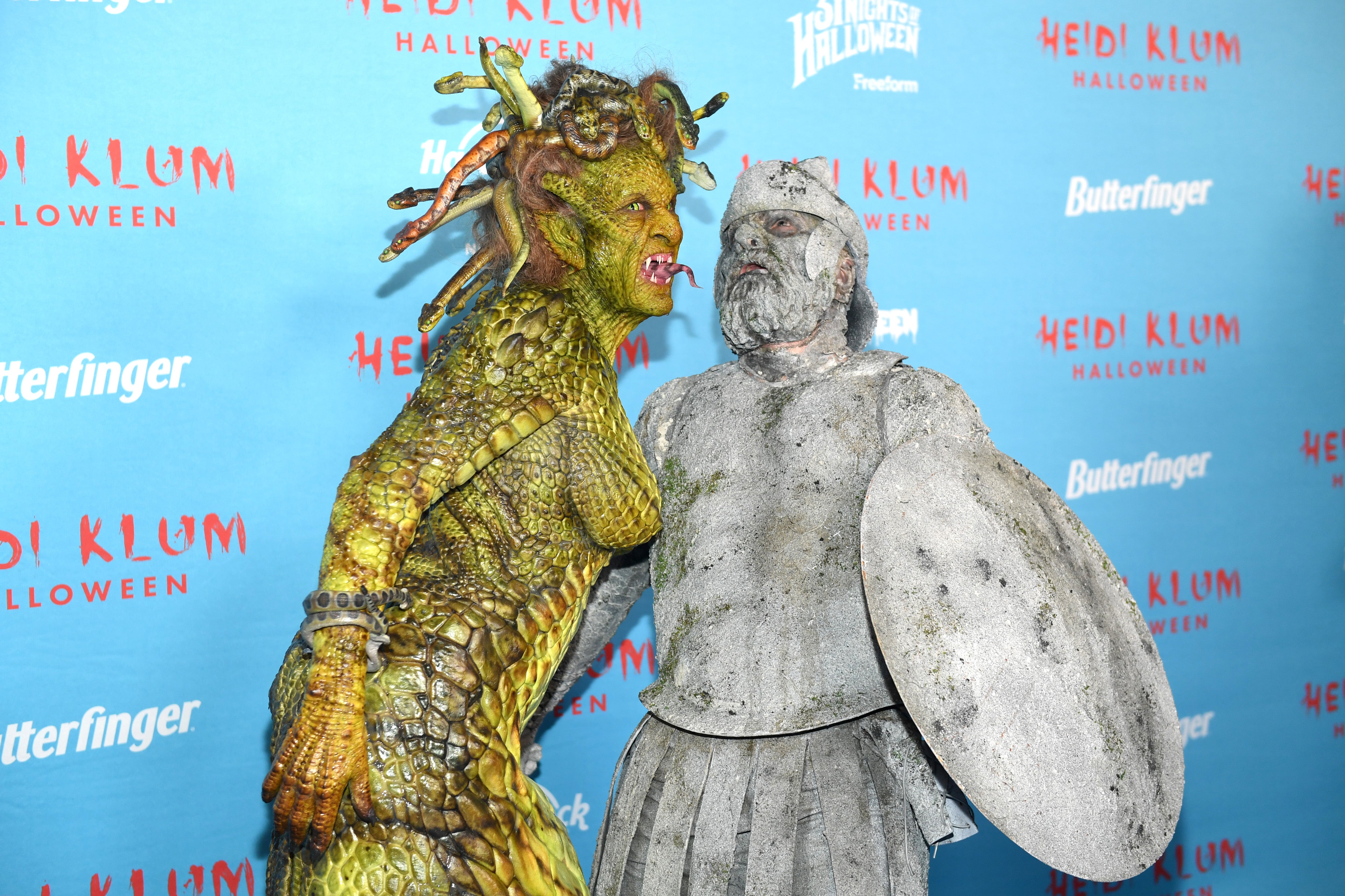 Klum and her husband posing together at Halloween