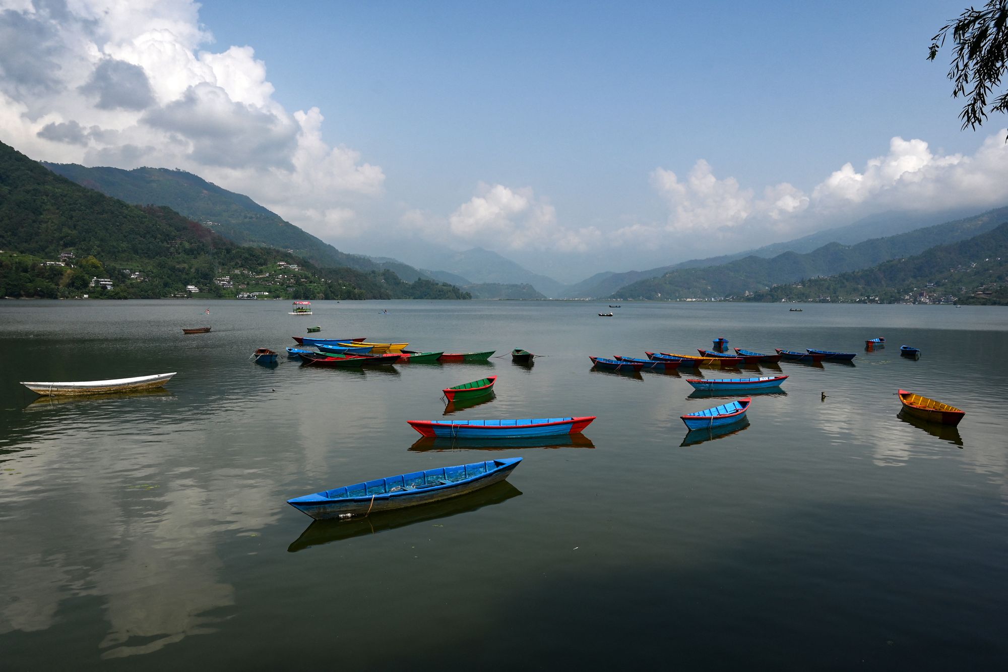 Boats are moored near the shore of Phewa lake at Nepal's Pokhara