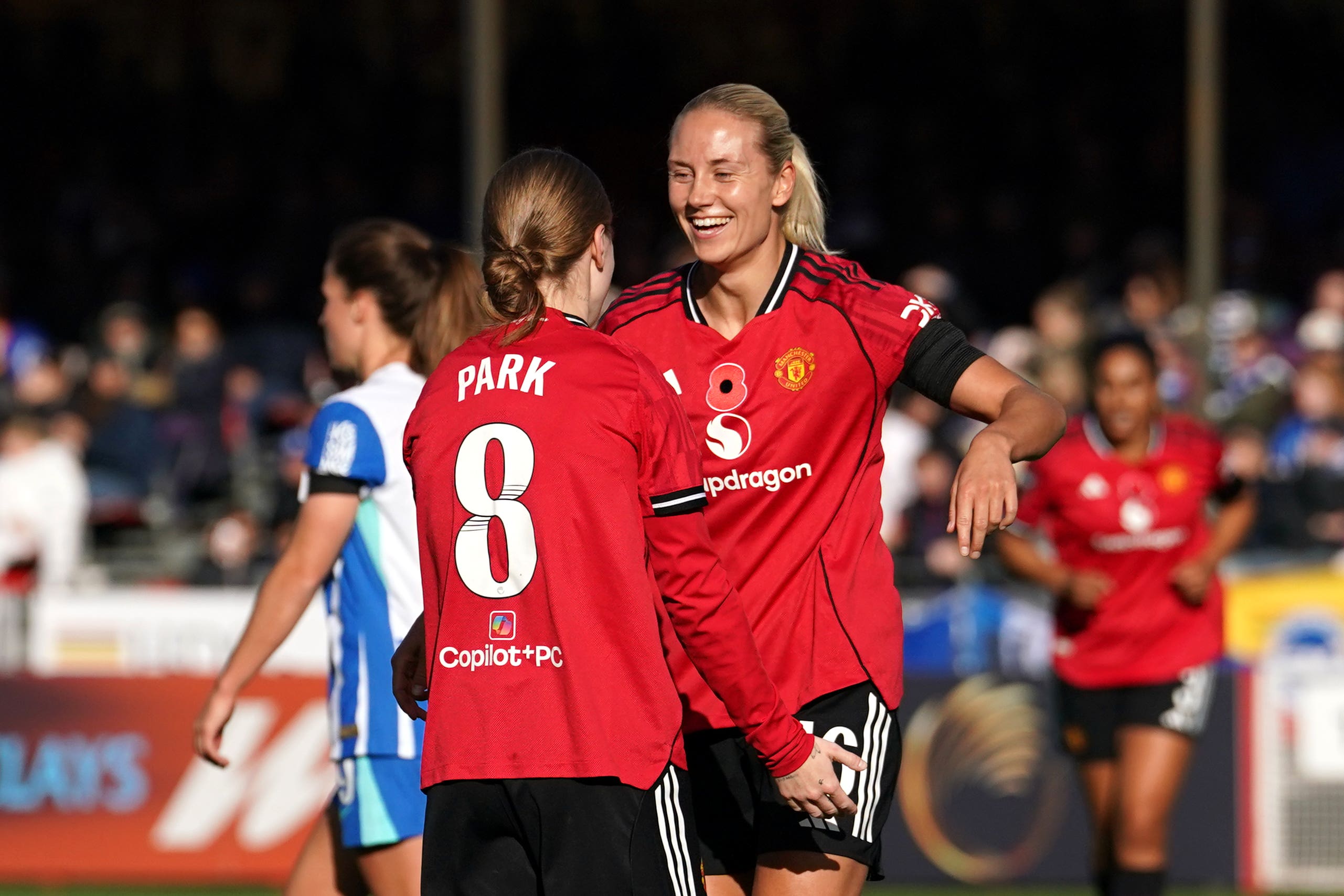 Lisa Naalsund celebrates scoring for Manchester United in a 3-2 win over Brighton with team-mate Jess Park (Gareth Fuller/PA).