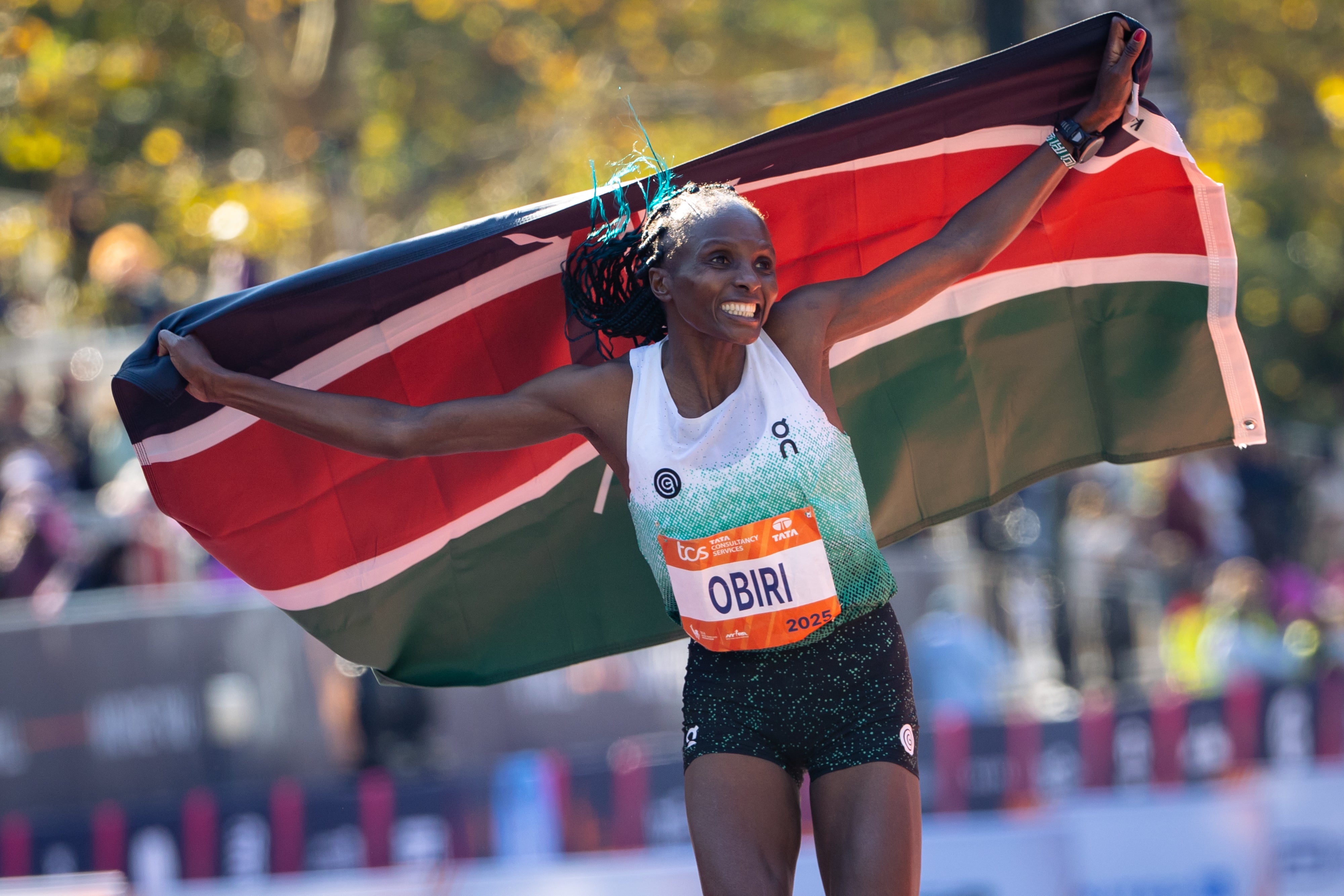 Hellen Obiri celebrates winning first place in the women's elite division
