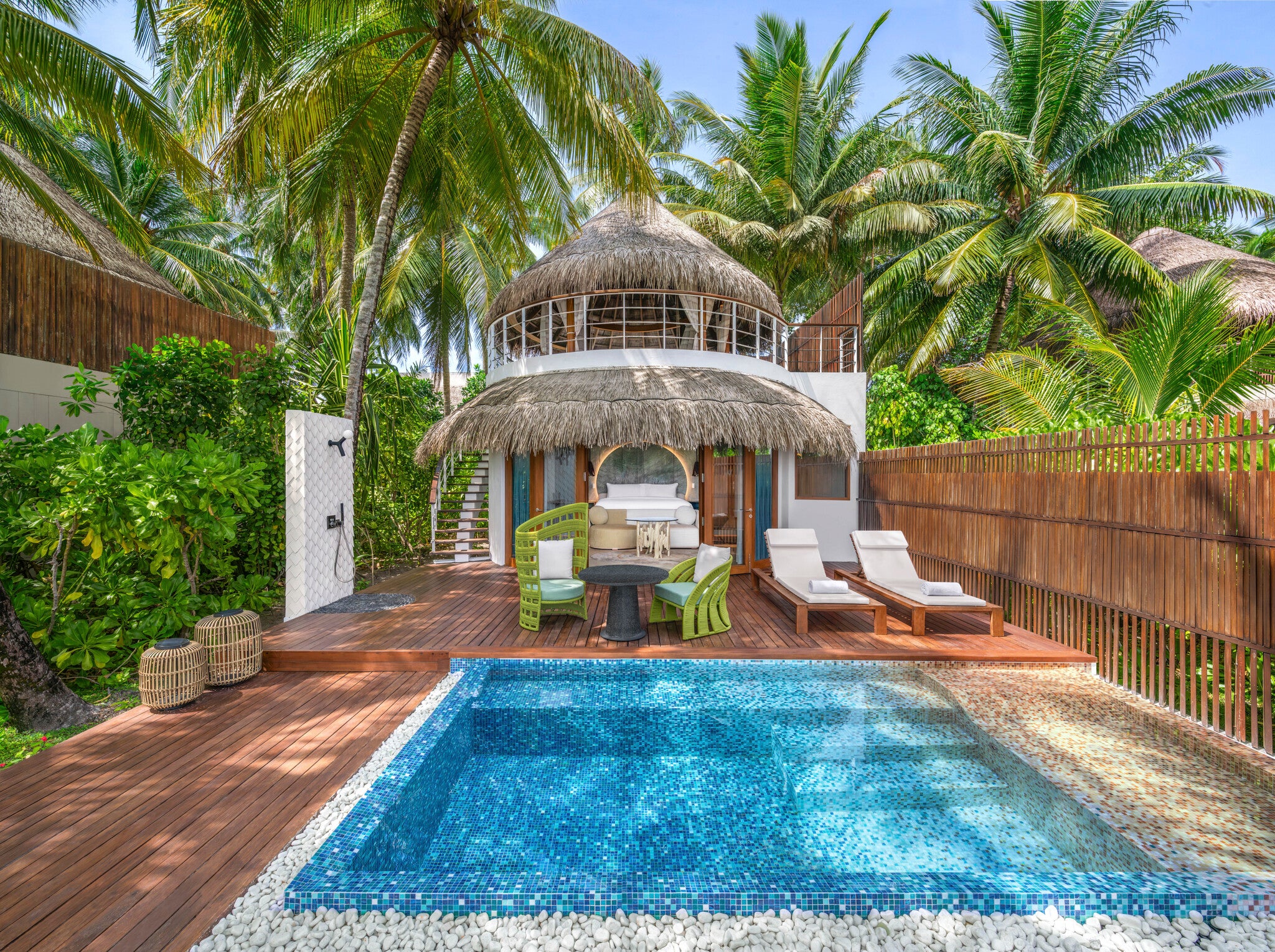 W Maldives’ beach villas channel the textures of mangroves, featuring orange colours, dark woods and leafy foliage