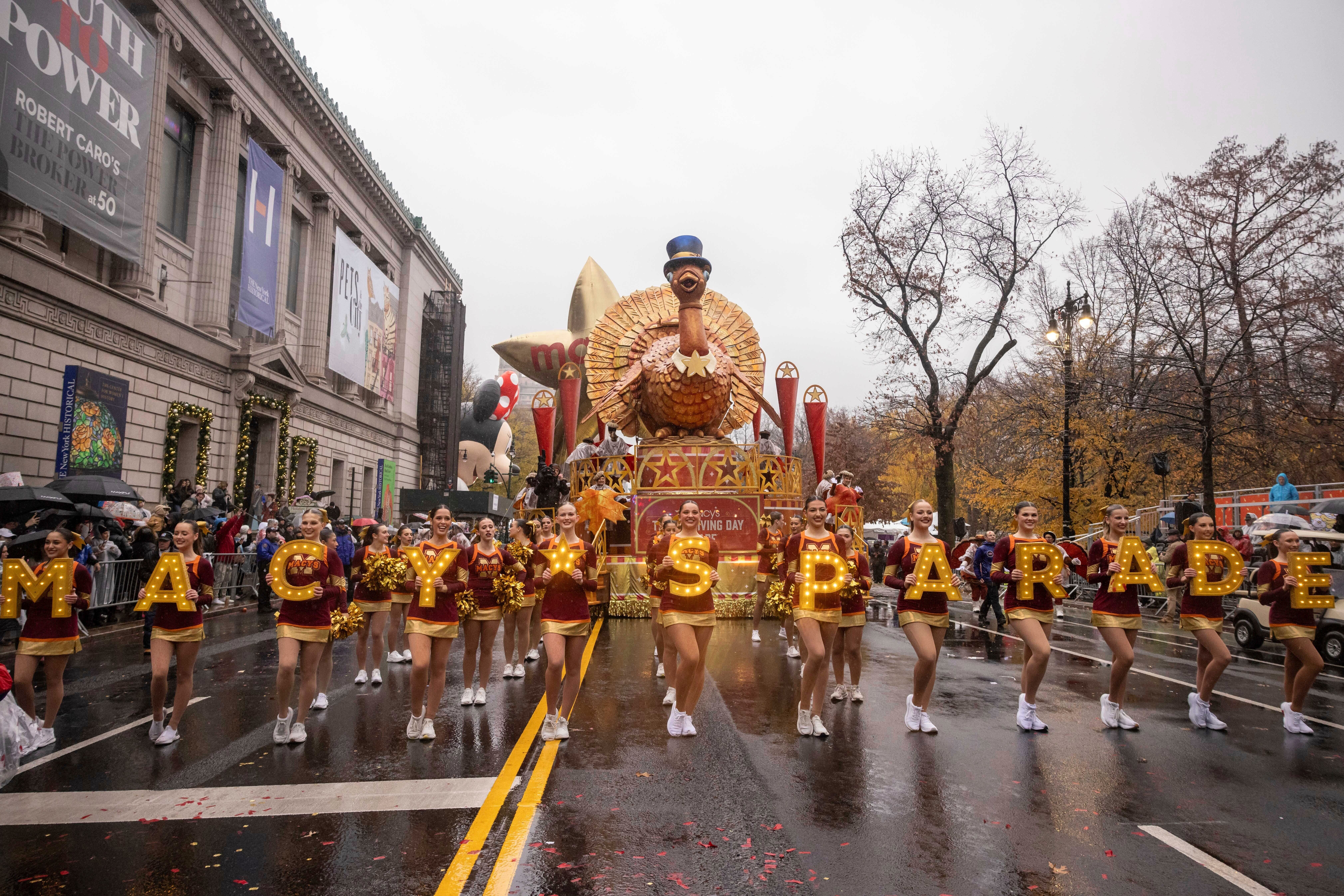 FILE - Parade performers lead the Tom Turkey float down Central Park West at the start of the Macy's Thanksgiving Day parade in New York on Nov. 28 2024