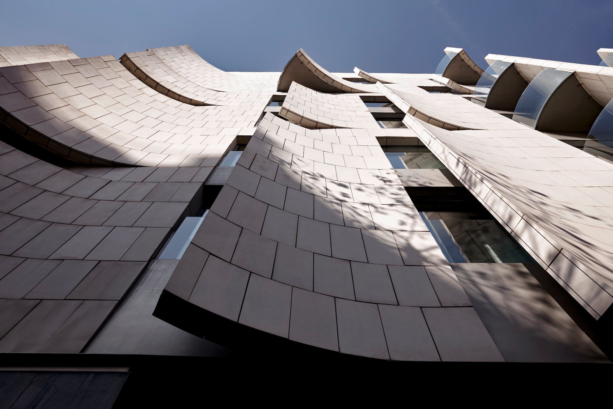 The hotel’s modern facade stands opposite Gaudi’s iconic and ornate La Pedrera
