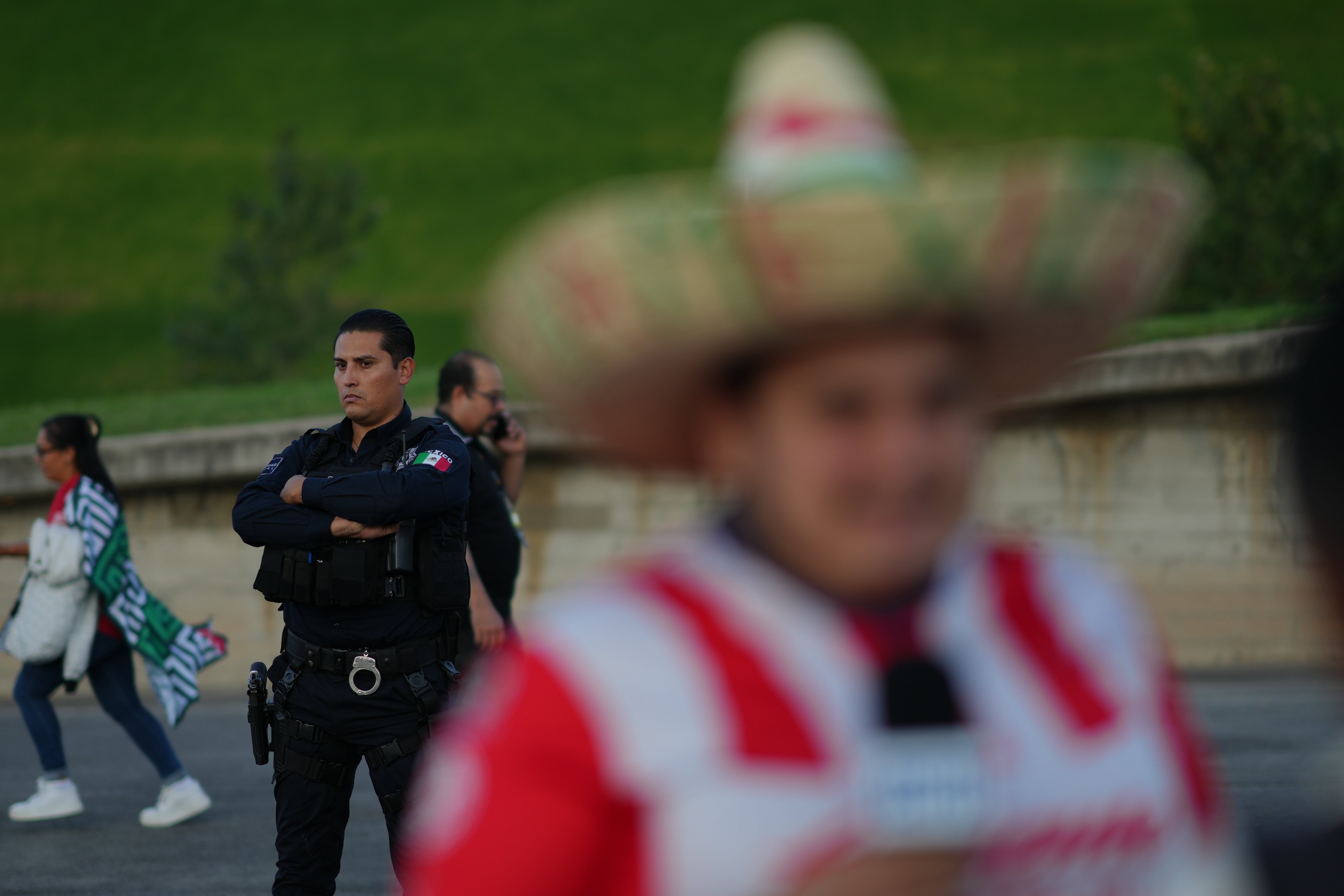 A police officer stands guard outside Akron Stadium prior to a friendly match between Mexico and Ecuador in Guadalajara, Mexico, Tuesday, Oct. 14, 2025