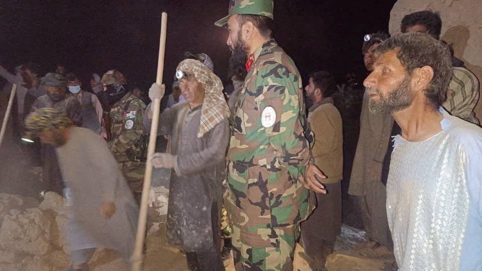 Rescuers work following an earthquake at an unidentified location in Afghanistan