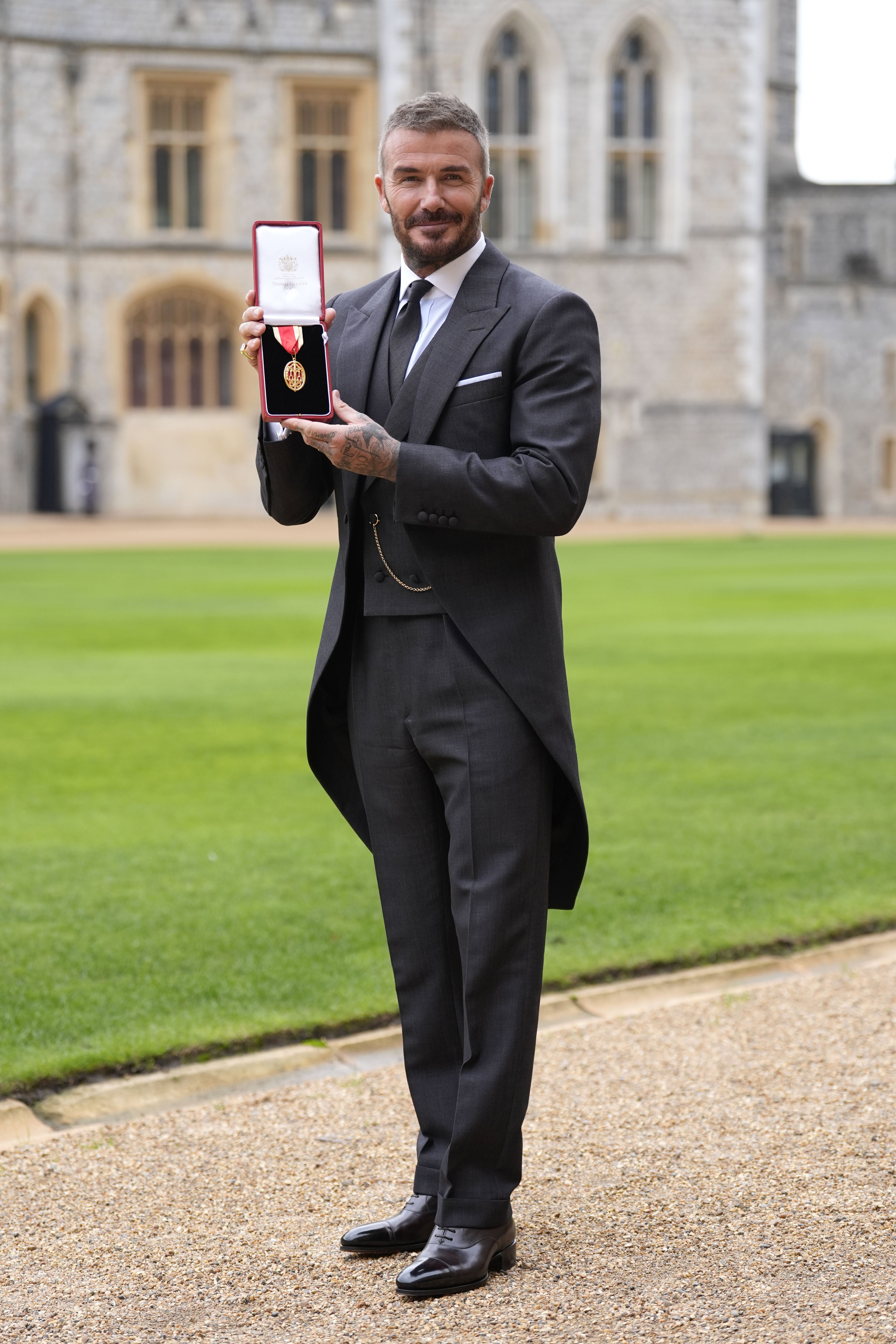 The former footballer was praised by King Charles for his suit
