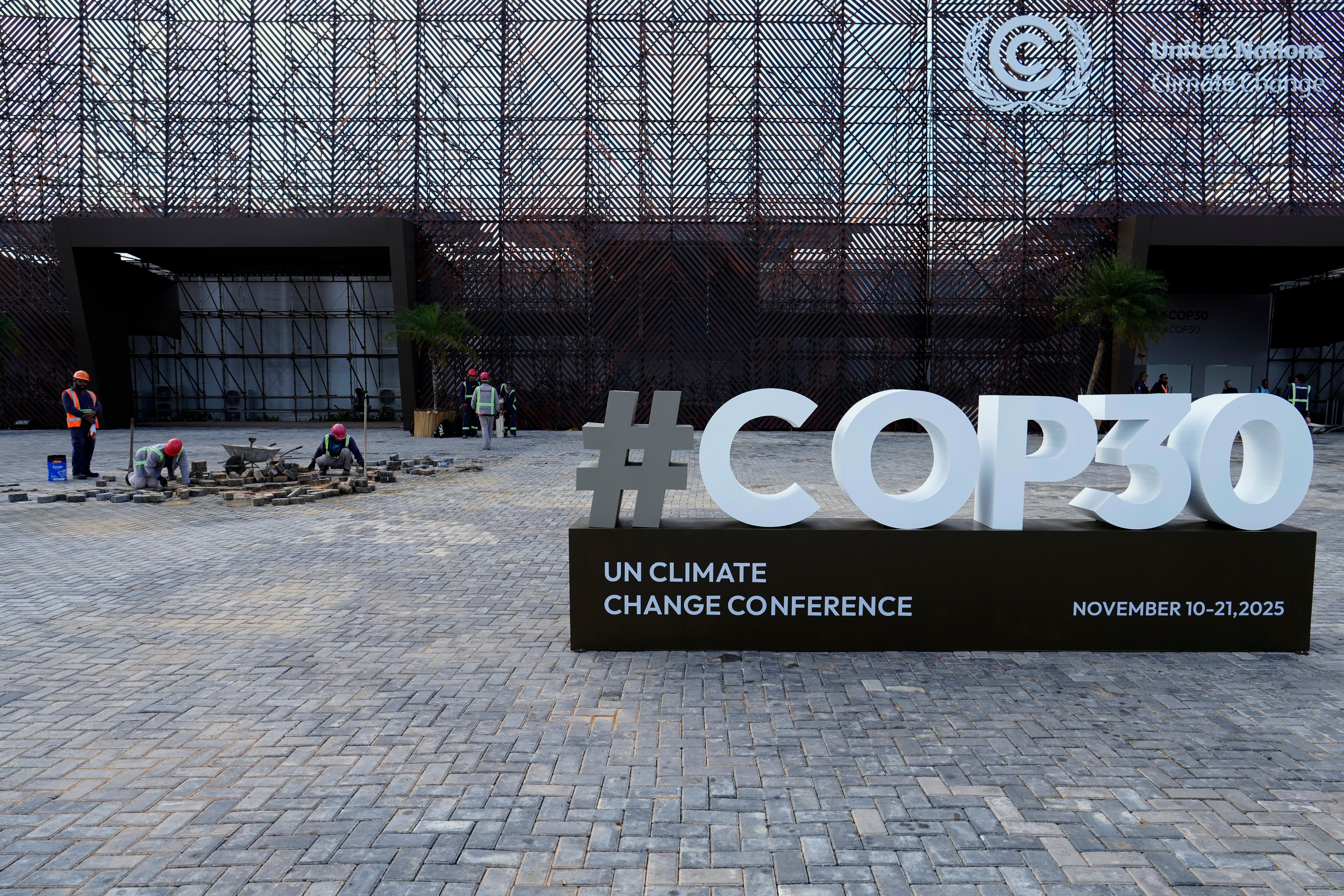 Workers make finishing touches to the conference venue for Cop30 in Belem, Brazil