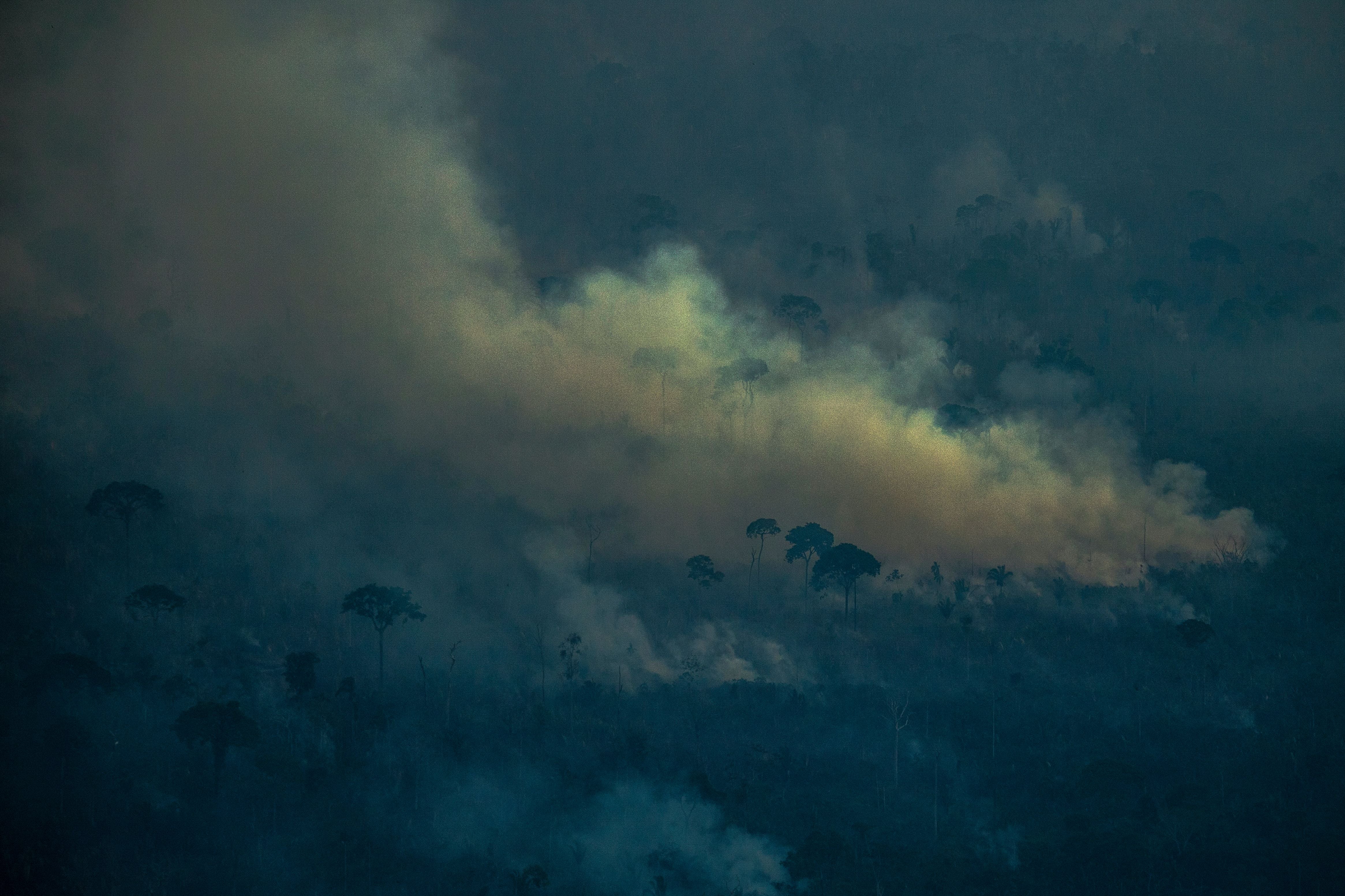 Smoke rises from a fire set in the Lábrea rainforest in September 2021. The fires have been tied to tens of thousands of hospitalizations and deaths in the region