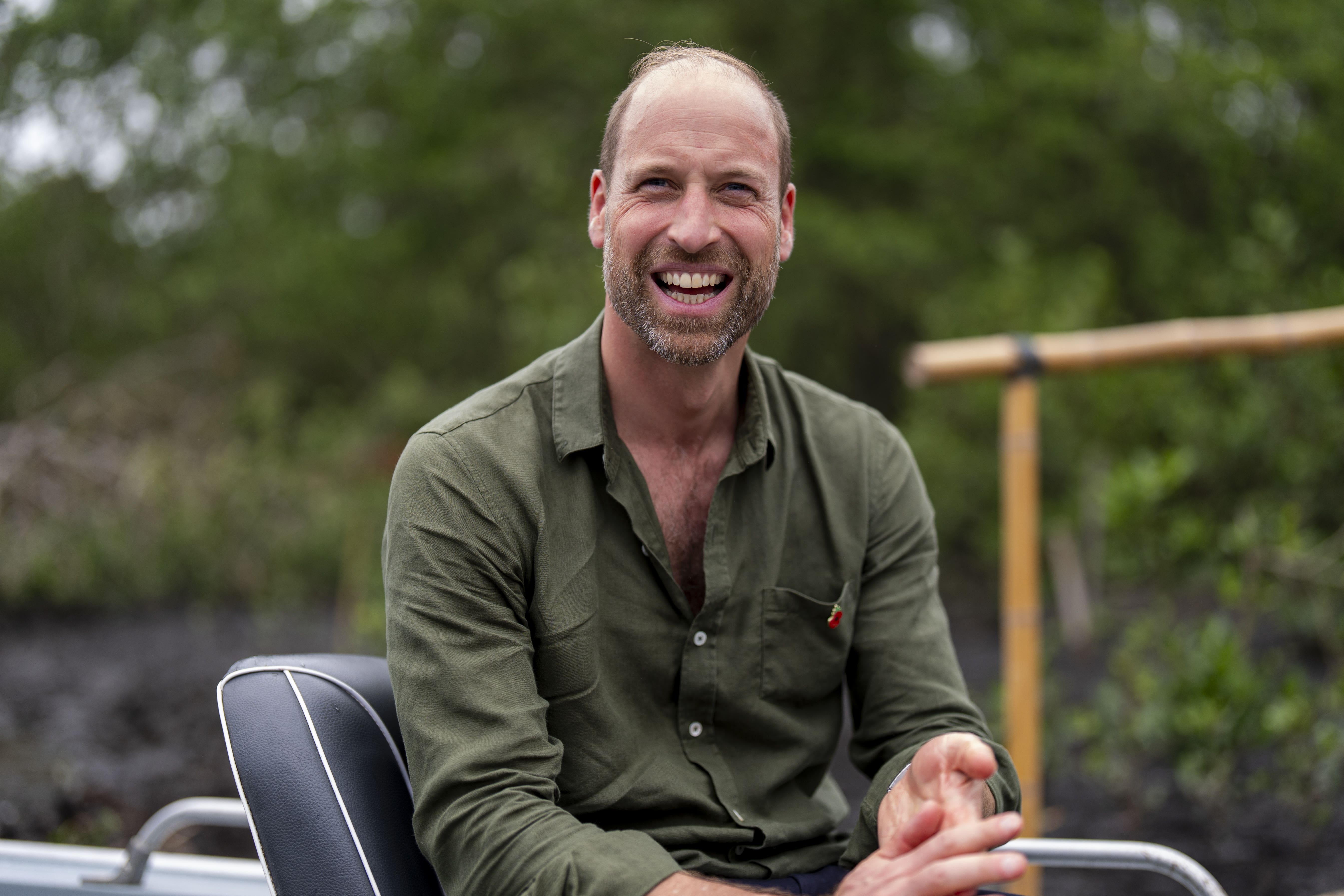The Prince of Wales on a boat during a tour of the Guapimirim mangrove area (Aaron Chown/PA)