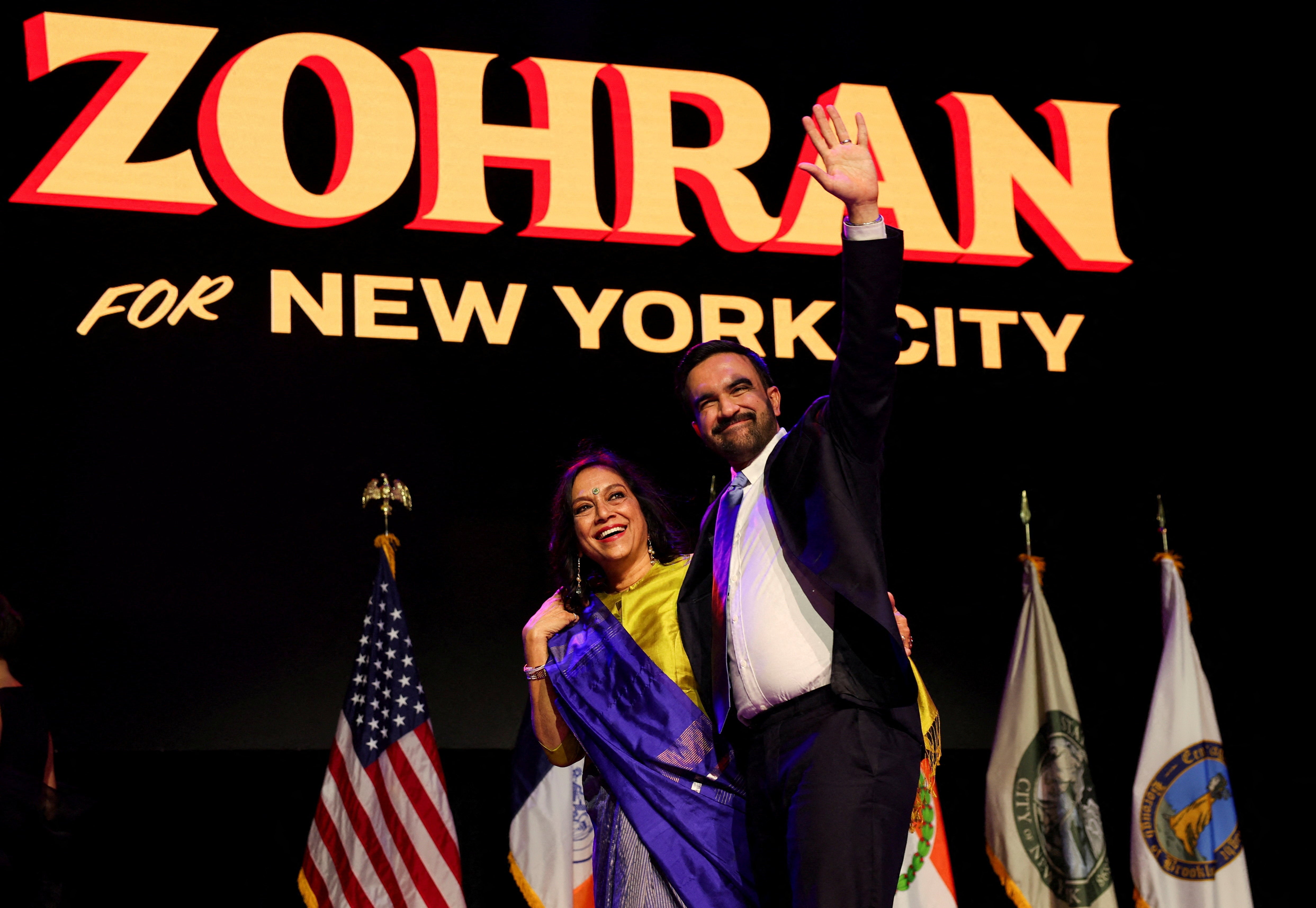 <p>Democratic candidate for New York City mayor Zohran Mamdani waves next to his mother Mira Nair onstage </p>