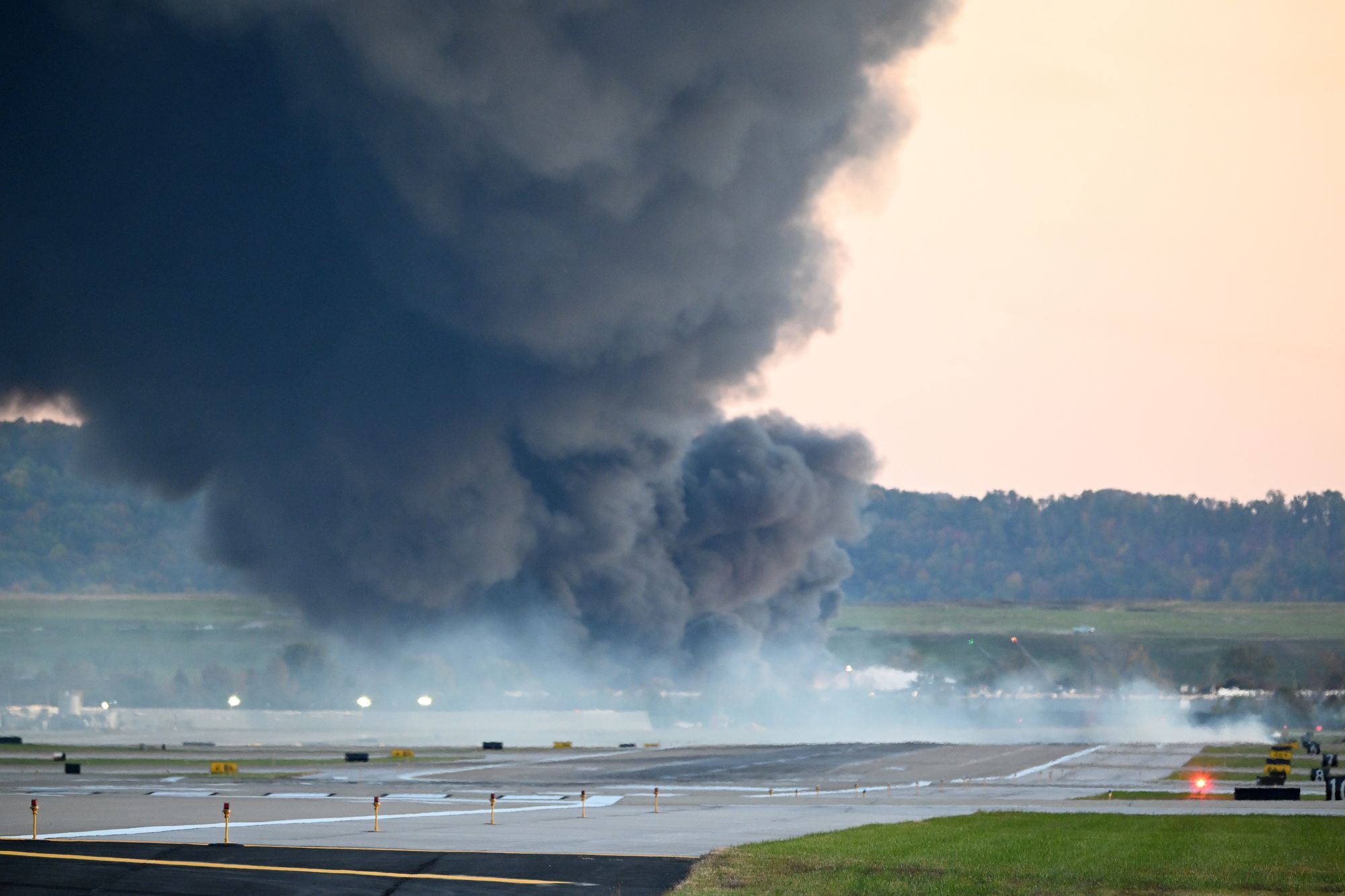 Fire and smoke mark where a UPS cargo plane crashed near Louisville Muhammad Ali International Airport on November 04, 2025 in Louisville, Kentucky. The fully fueled plane crashed shortly after takeoff with a shelter-in-place order issued for within 5 miles of the airport