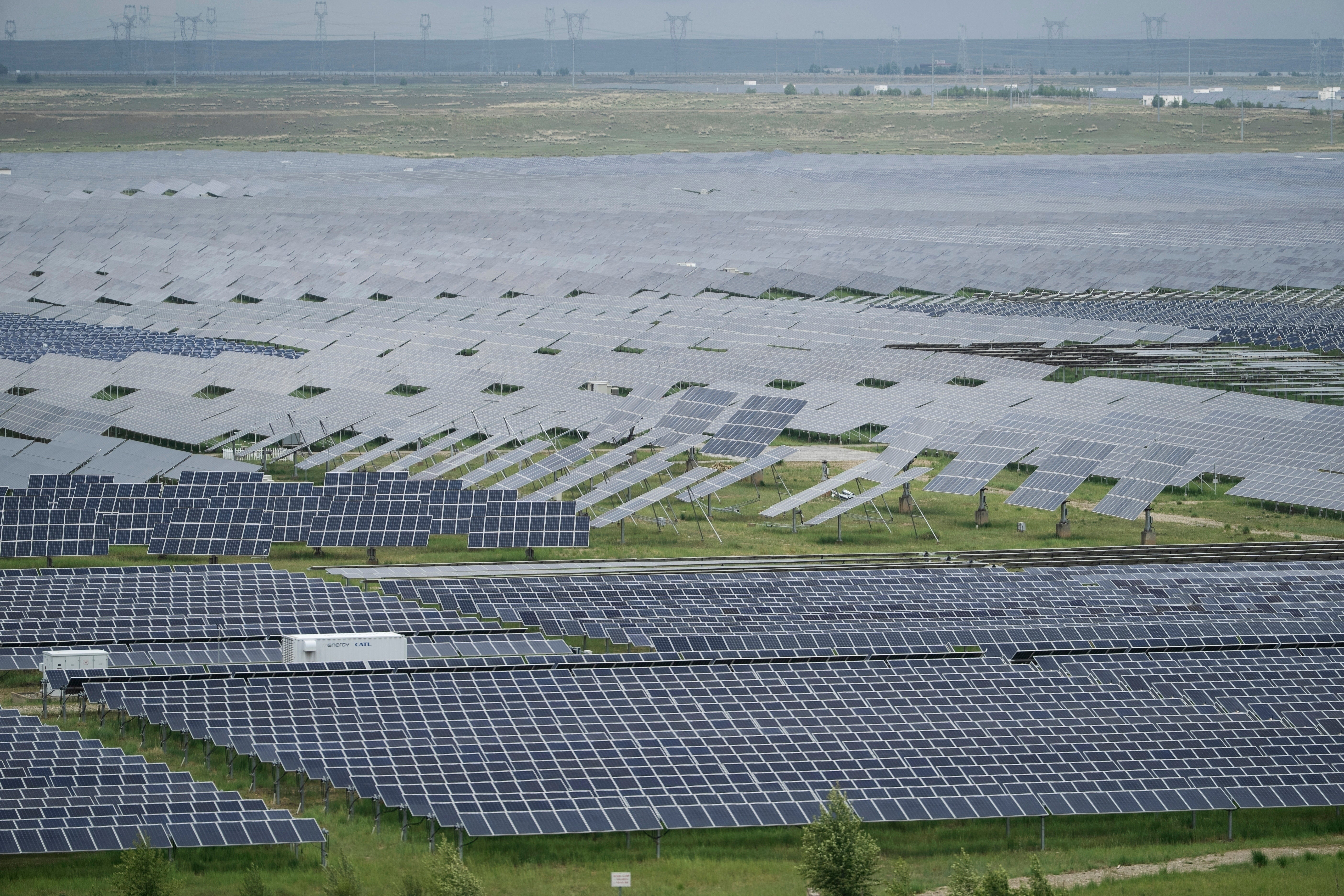 <p>FILE - A solar farm is visible in Hainan prefecture of western China's Qinghai province 1 July 2025</p>