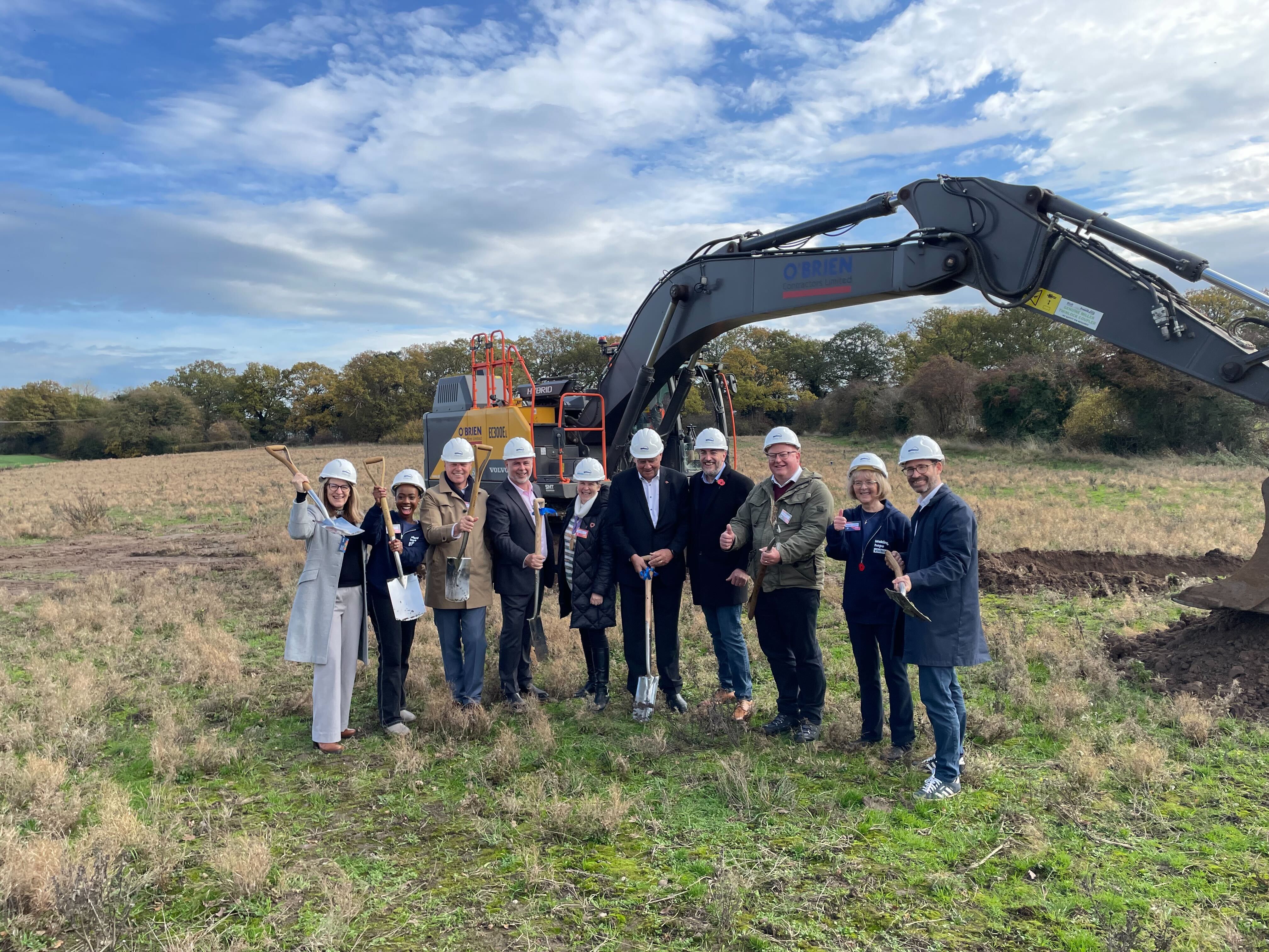 There were cheers as spades were dug into the ground for the first time to mark the start of work on the monument at the site, surrounded by motorway