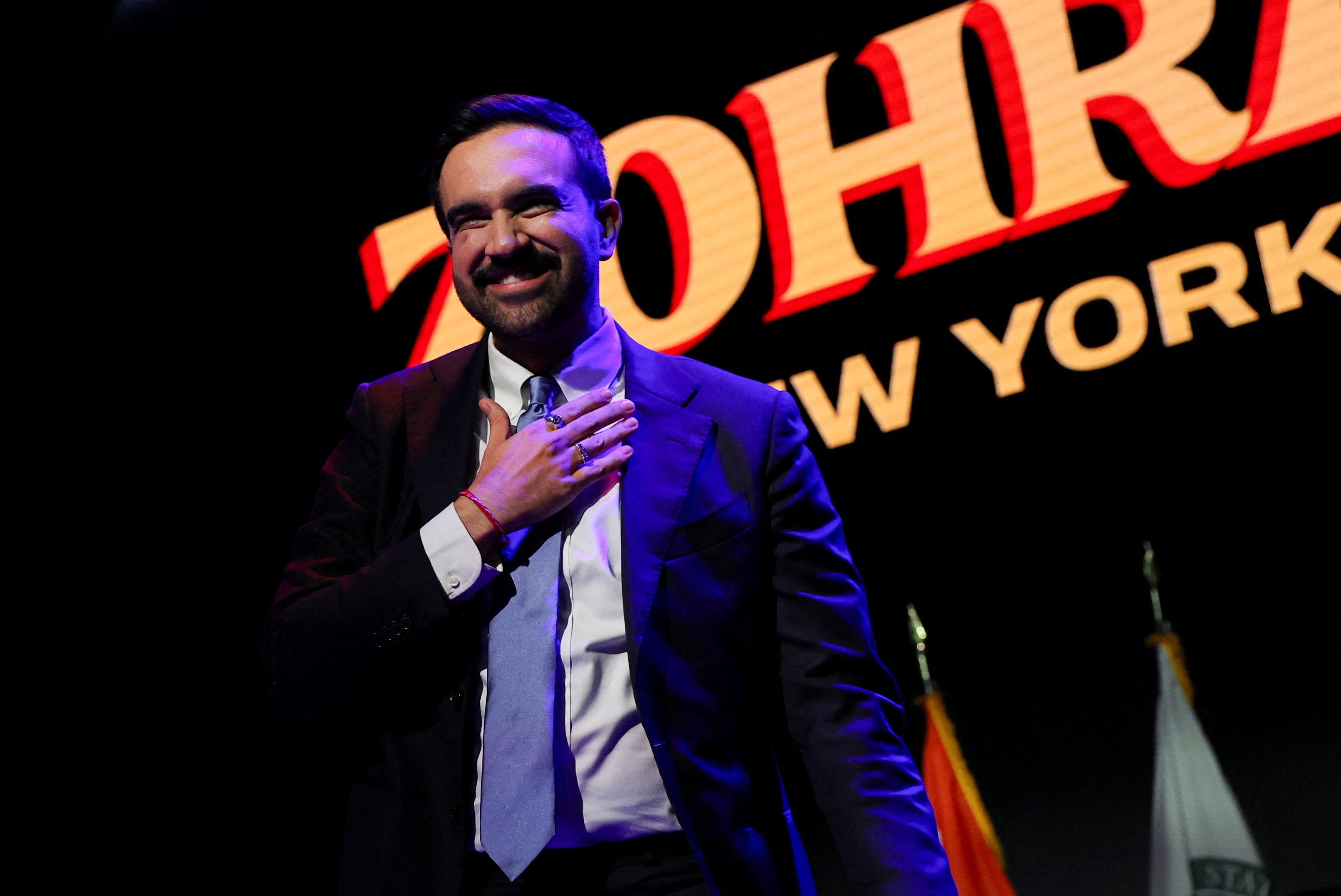 Democratic candidate Zohran Mamdani celebrates onstage after winning the race to be New York’s next mayor
