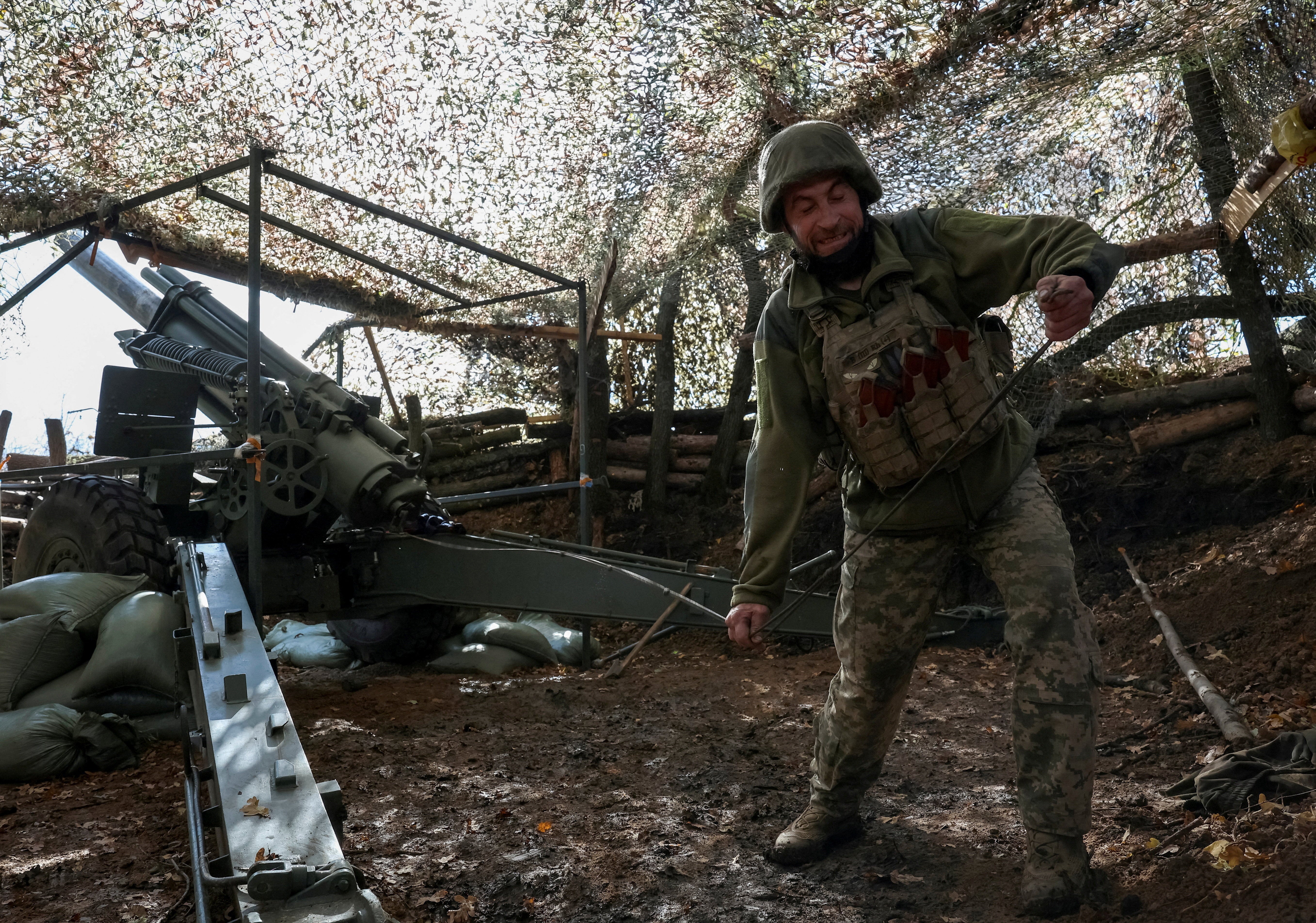 An artilleryman fires a howitzer towards Russian troops near the frontline town of Pokrovsk in Ukraine’s Donetsk region in October