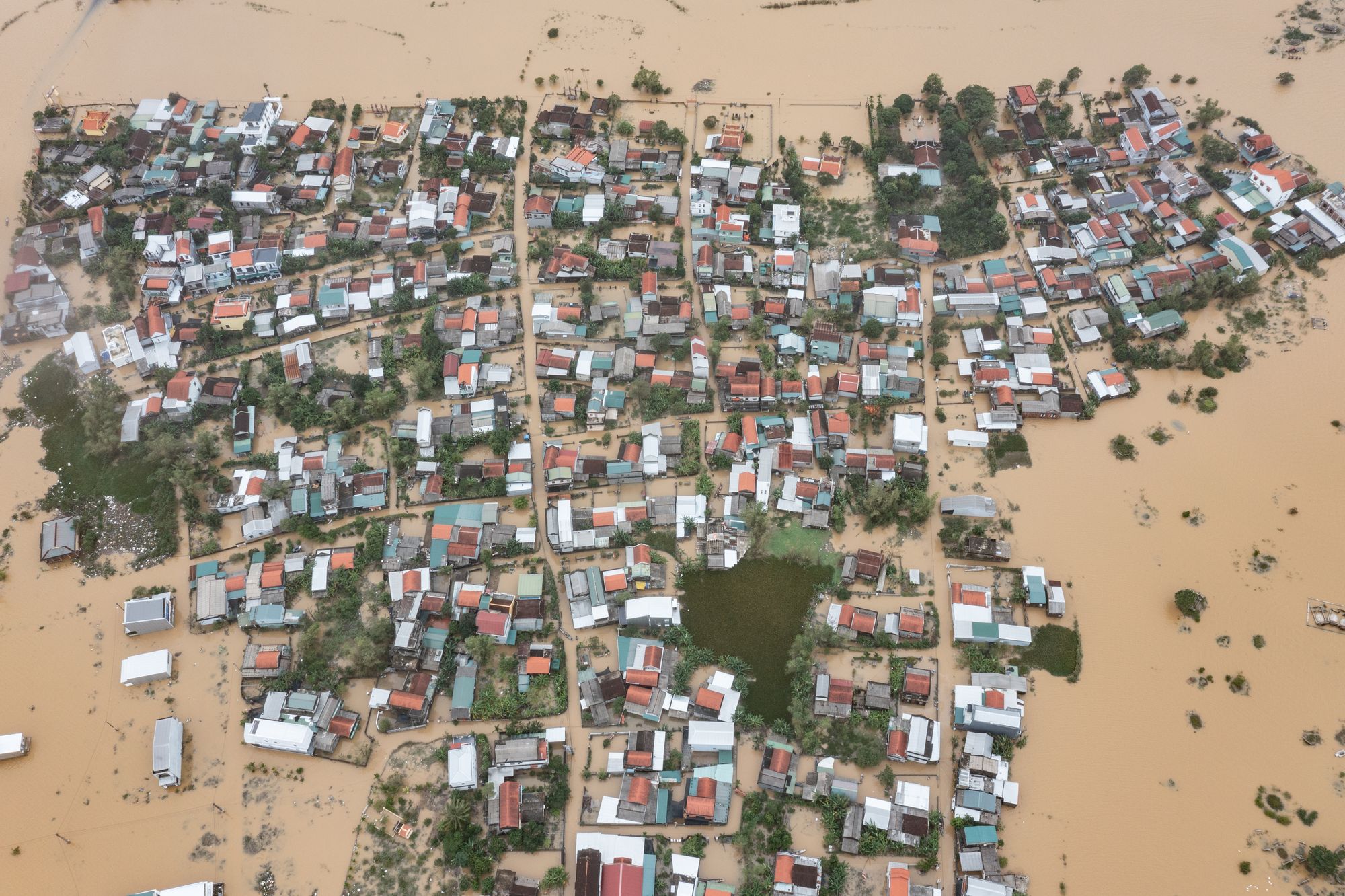 An aerial view shows Trieu Son Trung village, which has been isolated after days of heavy rain, on 4 November 2025 in Hue, Vietnam