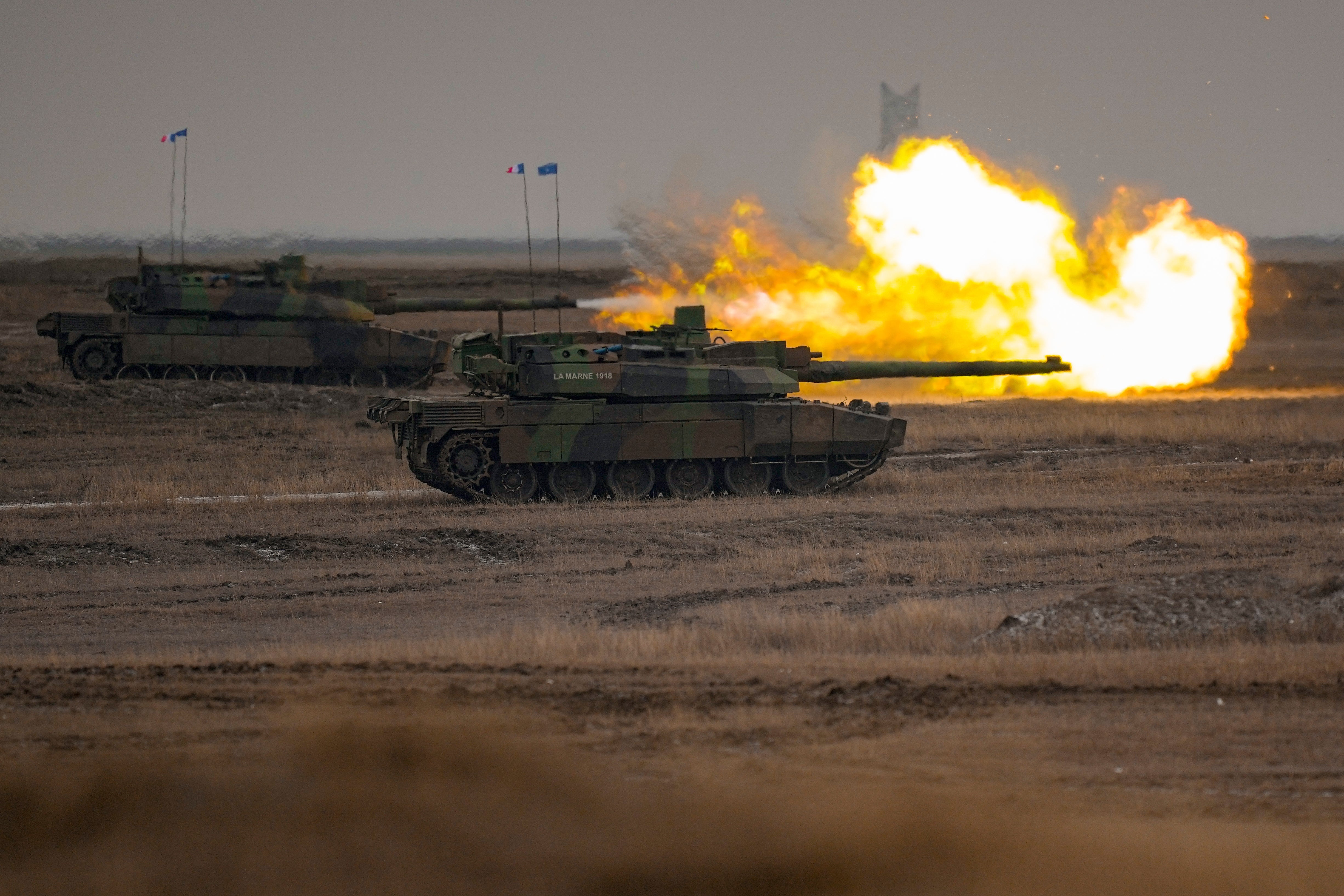 A French Leclerc main battle tank shoots during an exercise at a training range in Smardan, eastern Romania, on Jan. 25, 2023. (AP Photo/Vadim Ghirda, File)