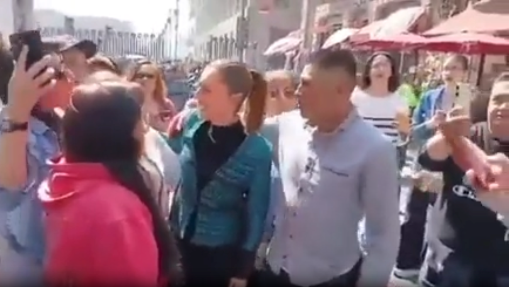 The man in the right foreground approached the president from behind