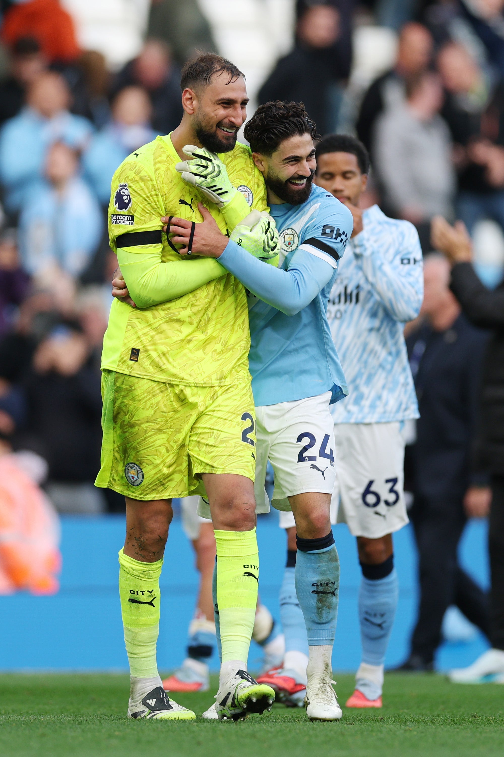 Gianluigi Donnarumma and Josko Gvardiol embrace at the Etihad Stadium