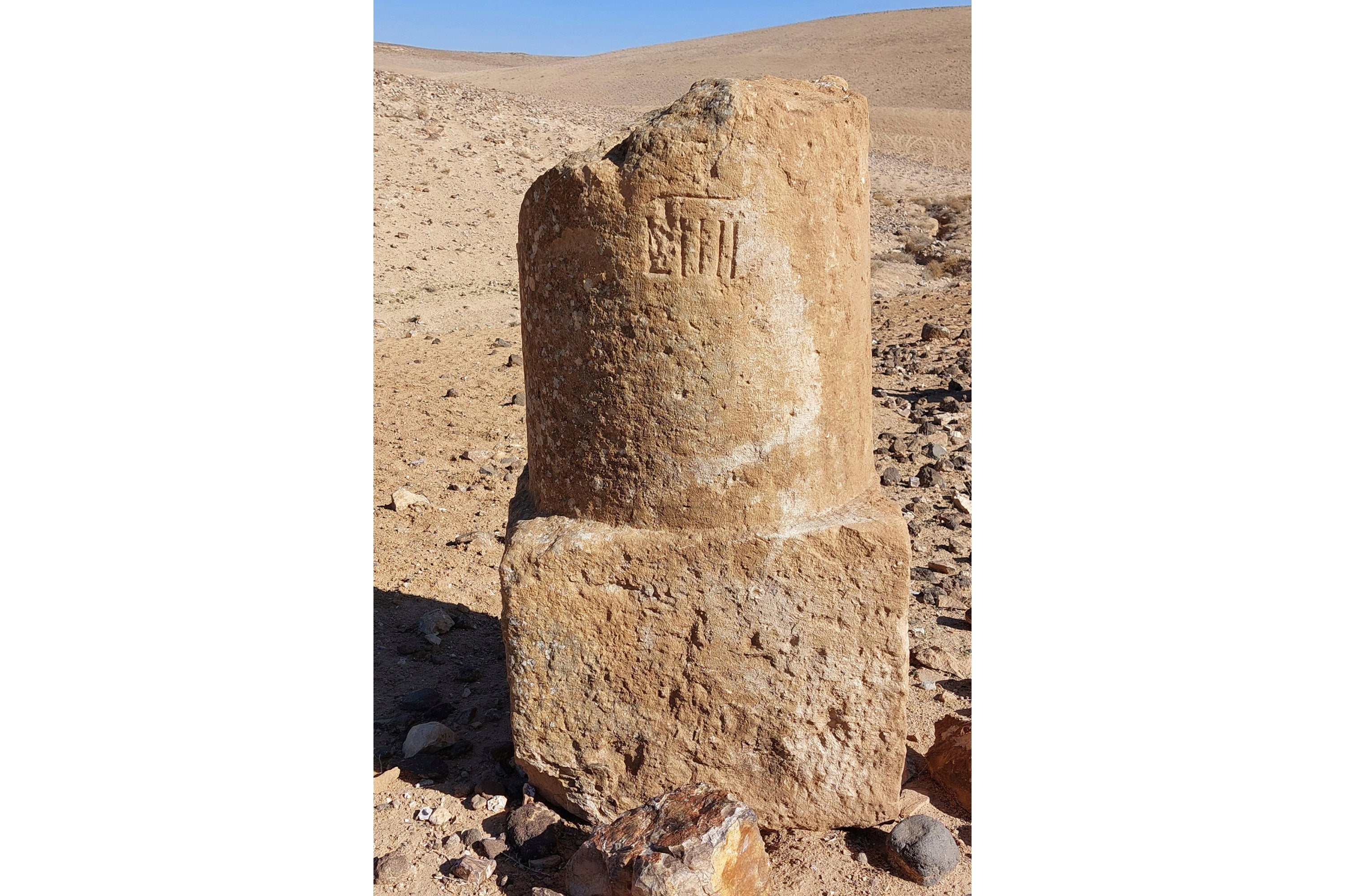 This photo provided by Adam Pažout shows a fragment of a Roman milestone that was erected along the road Via Nova Traiana in Jordan. (Adam Pažout/Itiner-e via AP)