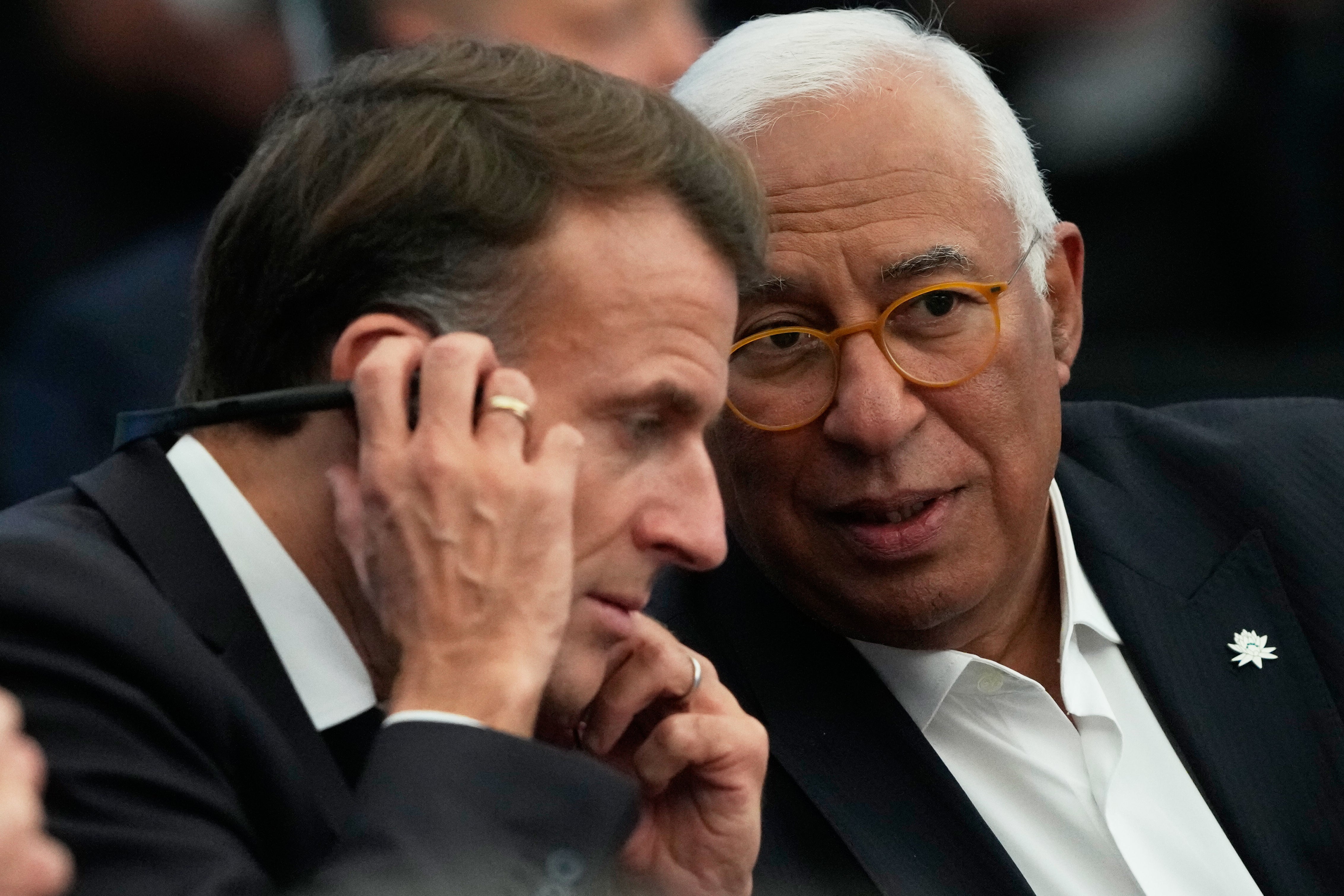 European Council president Antonio Costa is seen with France’s President Macron in Belem