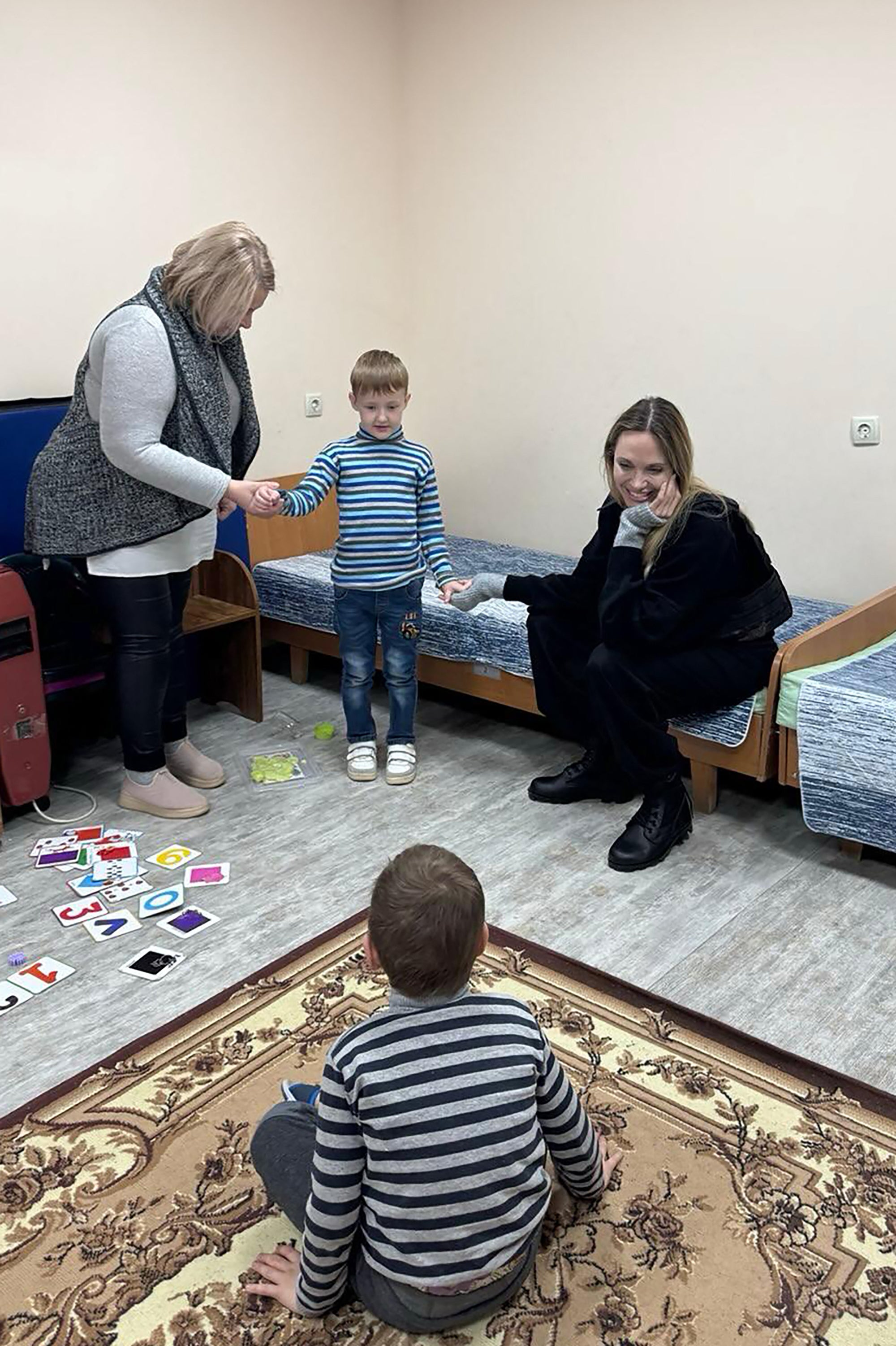 Angelina Jolie meets with children at an undisclosed location during her visit to Kherson and Mykolaiv