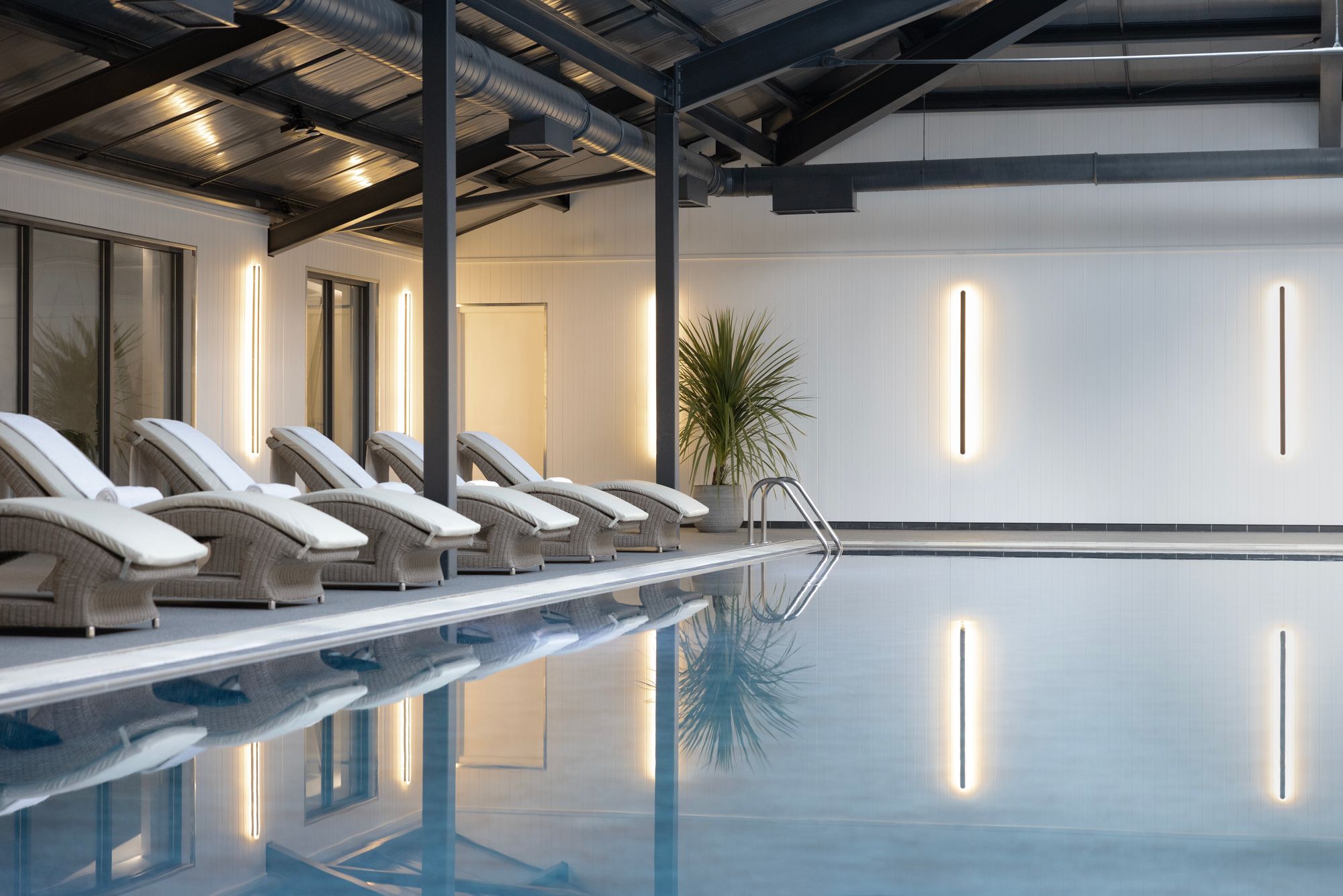 The swimming pool is overlooked by a large, well-equipped gym