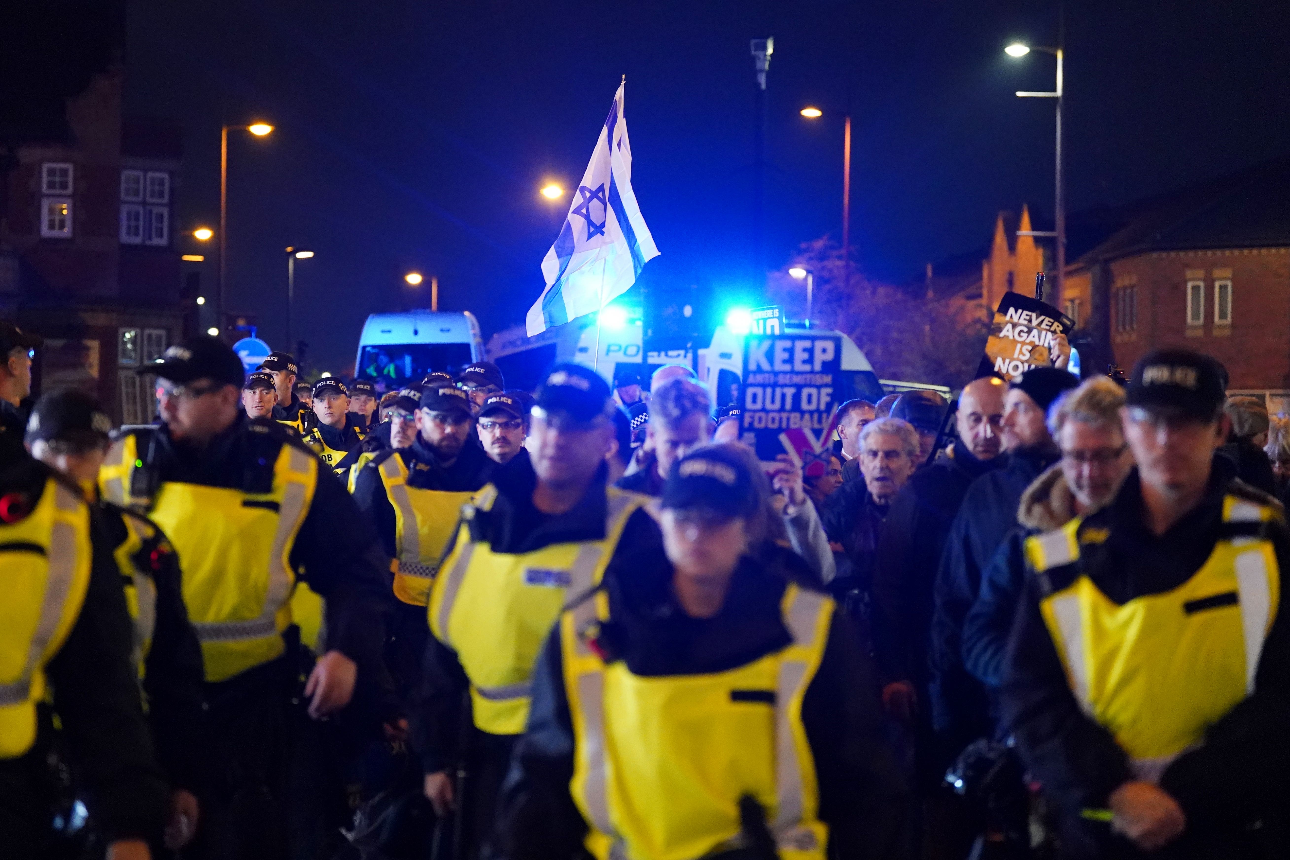 Pro Israel supporters are led away from Villa Park (Jacob King/PA)