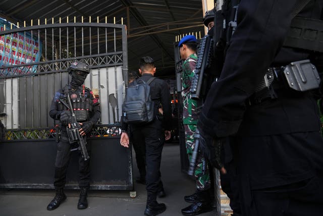 <p>Police officers stand guard at the gate of a school where explosions reportedly occurred, in Jakarta, Indonesia, Friday, Nov. 7, 2025. (AP Photo/Dita Alangkara)</p>