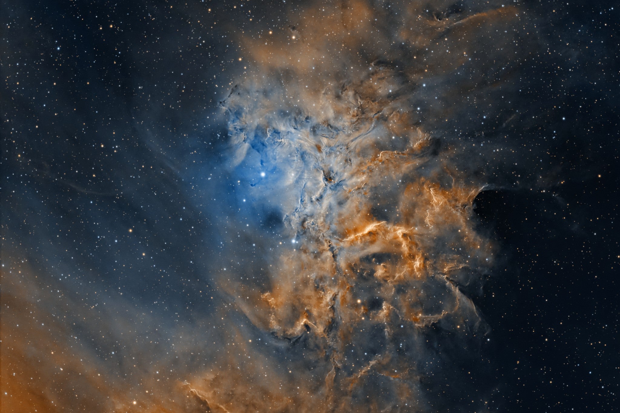 <p>The jewel of the cosmic charioteer is the glowing gas cloud known as the Flaming Star Nebula</p>