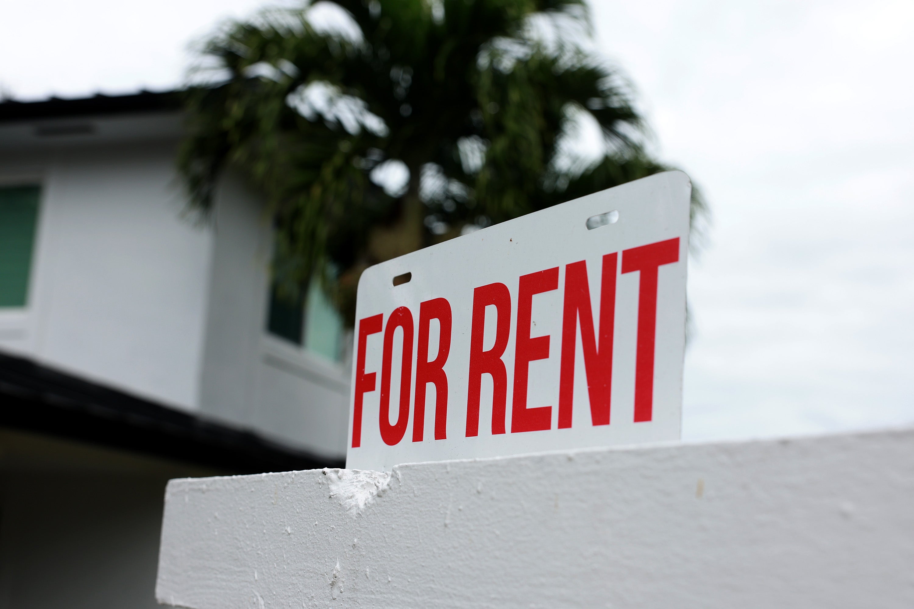 A "for rent" sign is posted in front of a home on December 12, 2023 in Miami, Florida