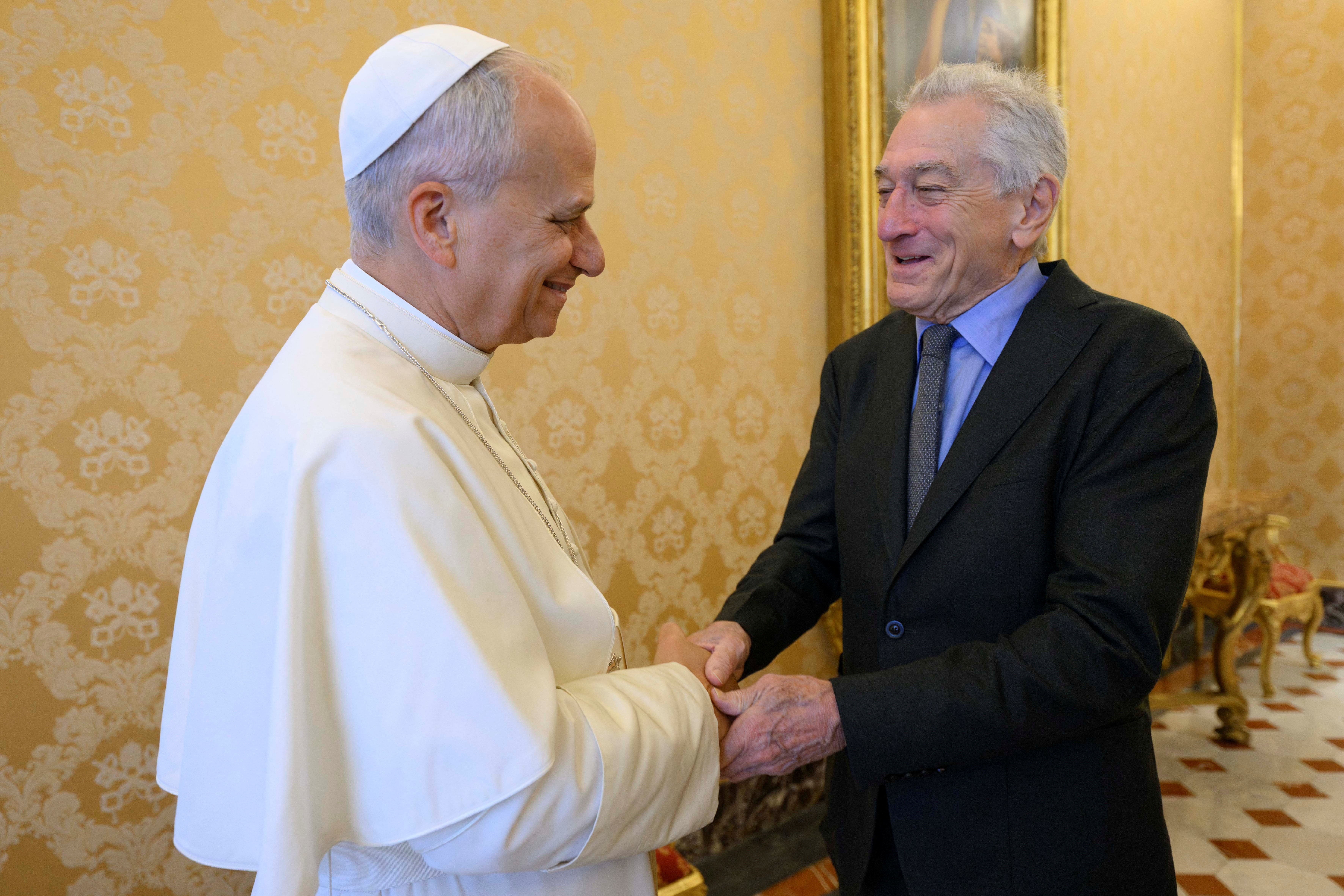 Pope Leo XIV shakes hands with actor Robert De Niro at the Vatican