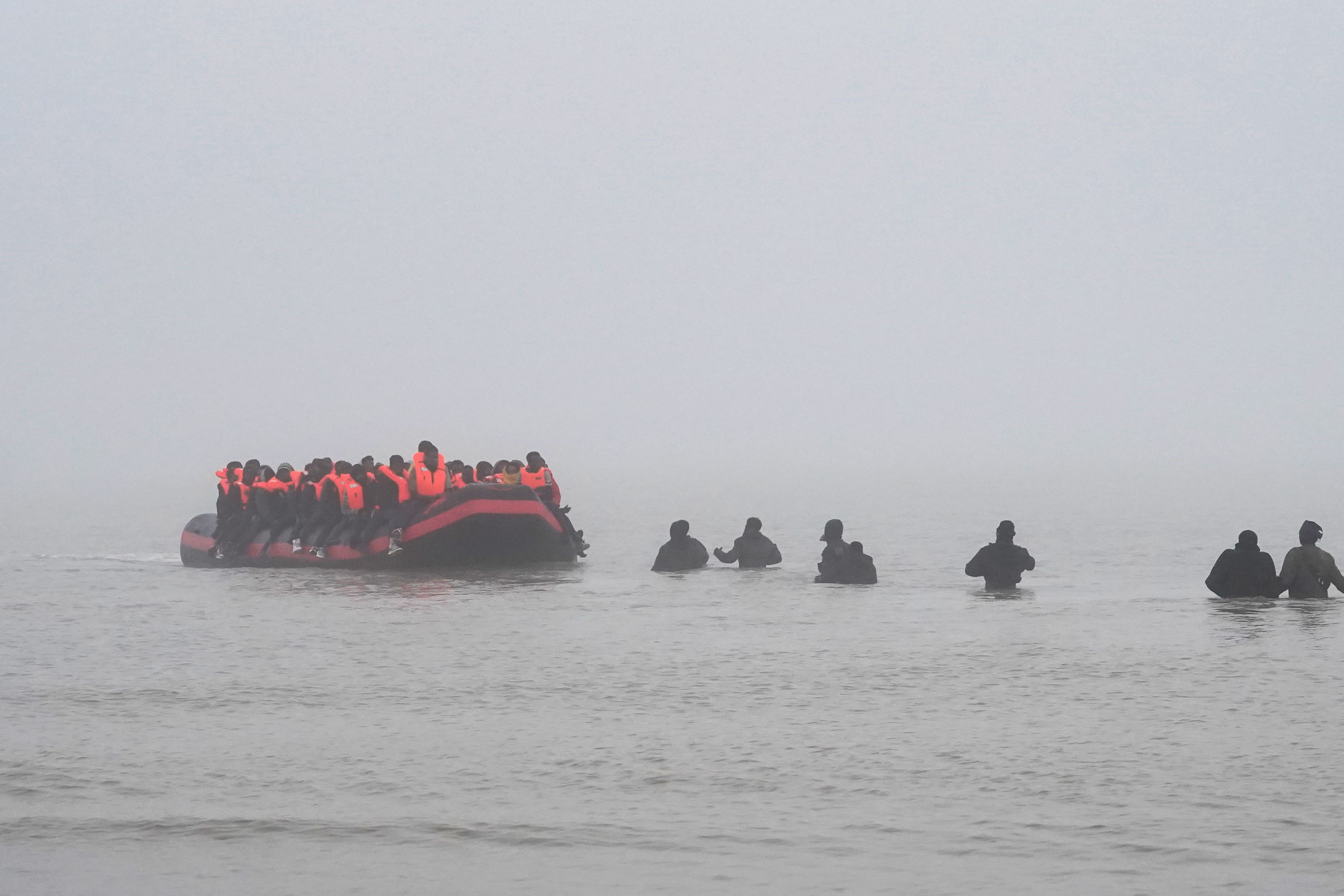 People thought to be migrants board a small boat in Gravelines, France (Gareth Fuller/PA)
