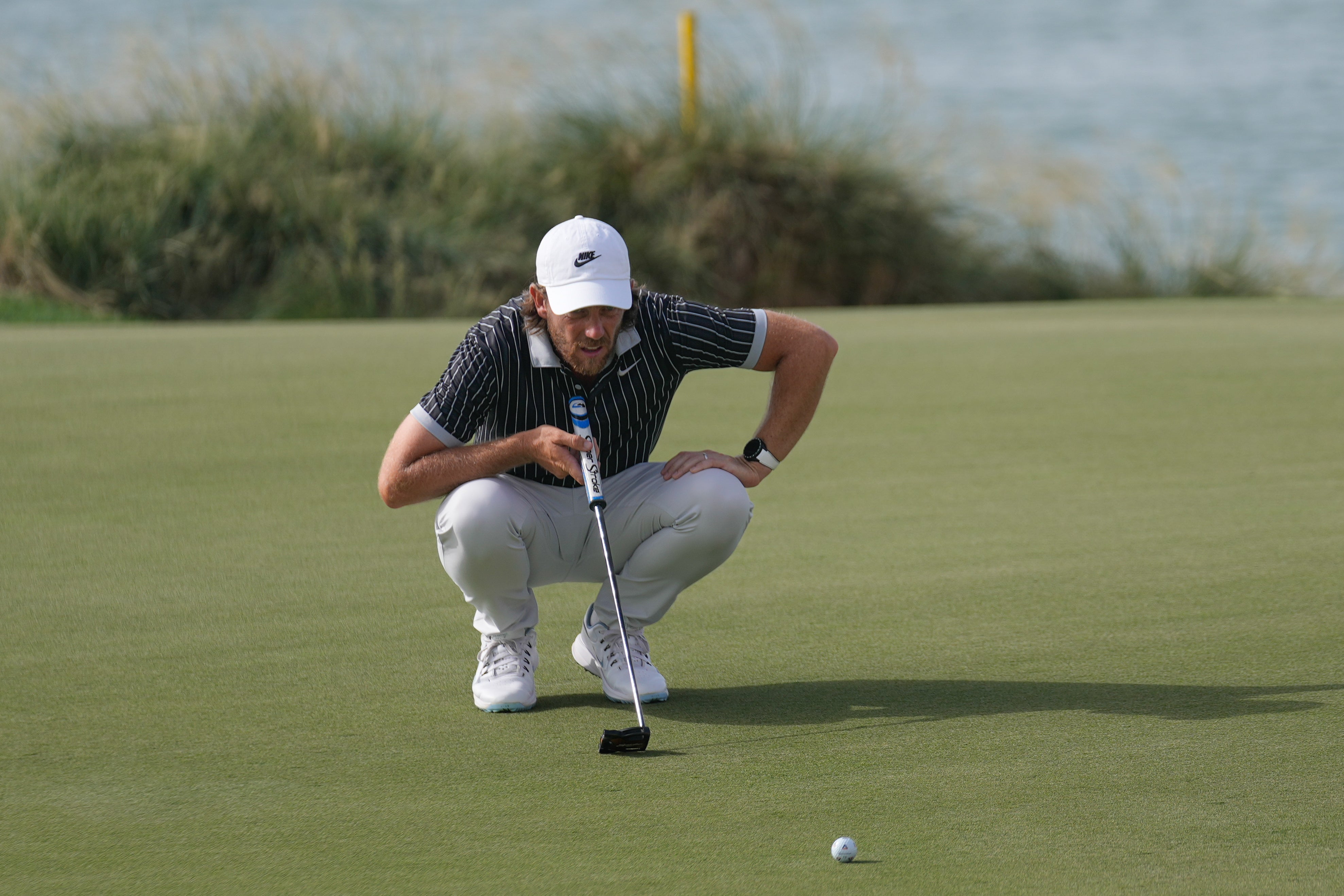 <p>Tommy Fleetwood shares the lead in Abu Dhabi</p>