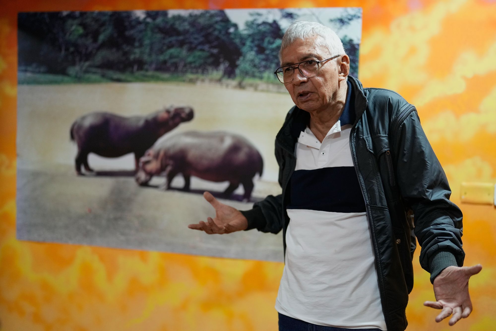 Édgar Jiménez in front of his photograph collection