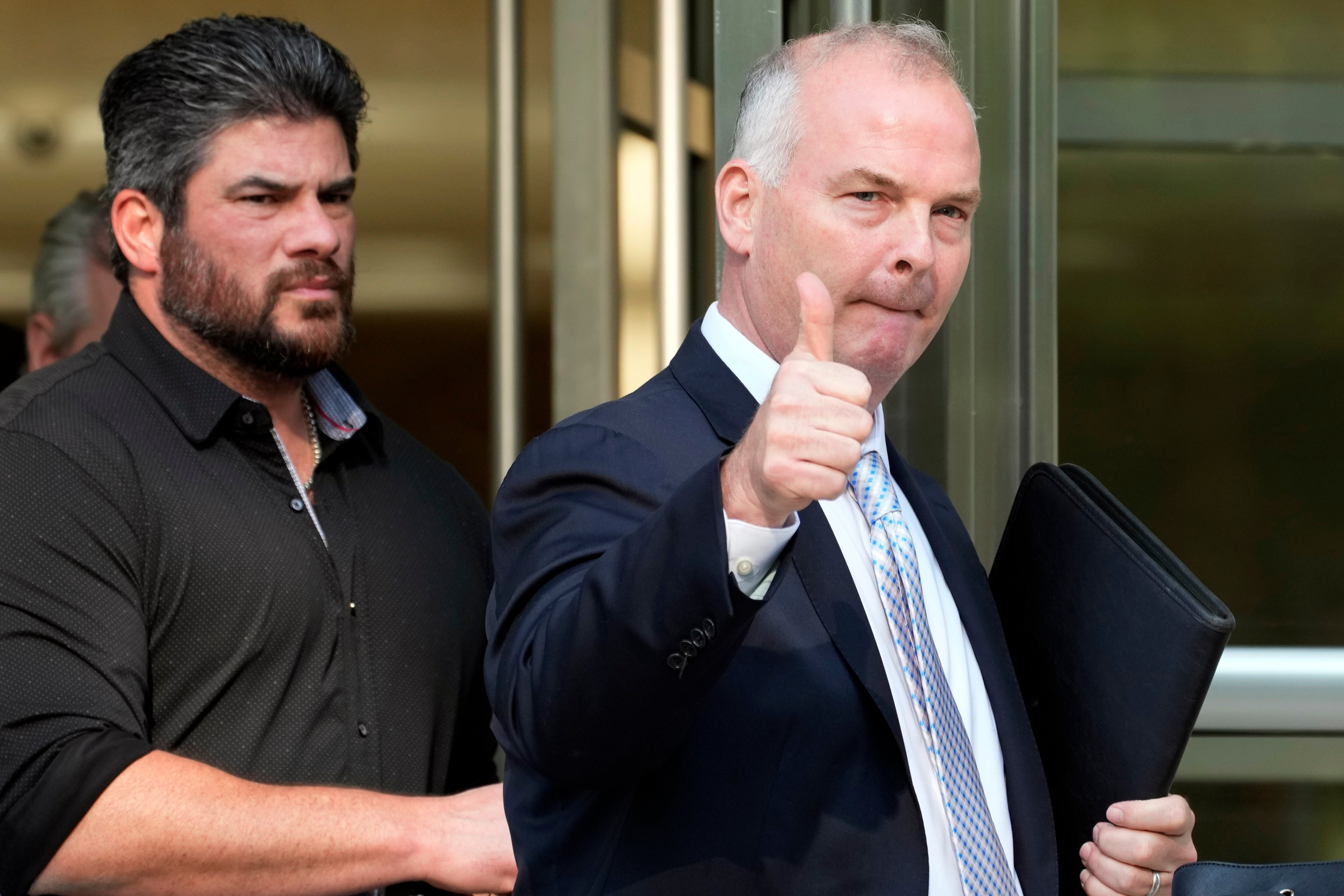Michael McMahon, right, gives photographers a thumbs up as he leaves federal court, May 31, 2023, in the Brooklyn borough of New York. (AP Photo/Mary Altaffer, File)