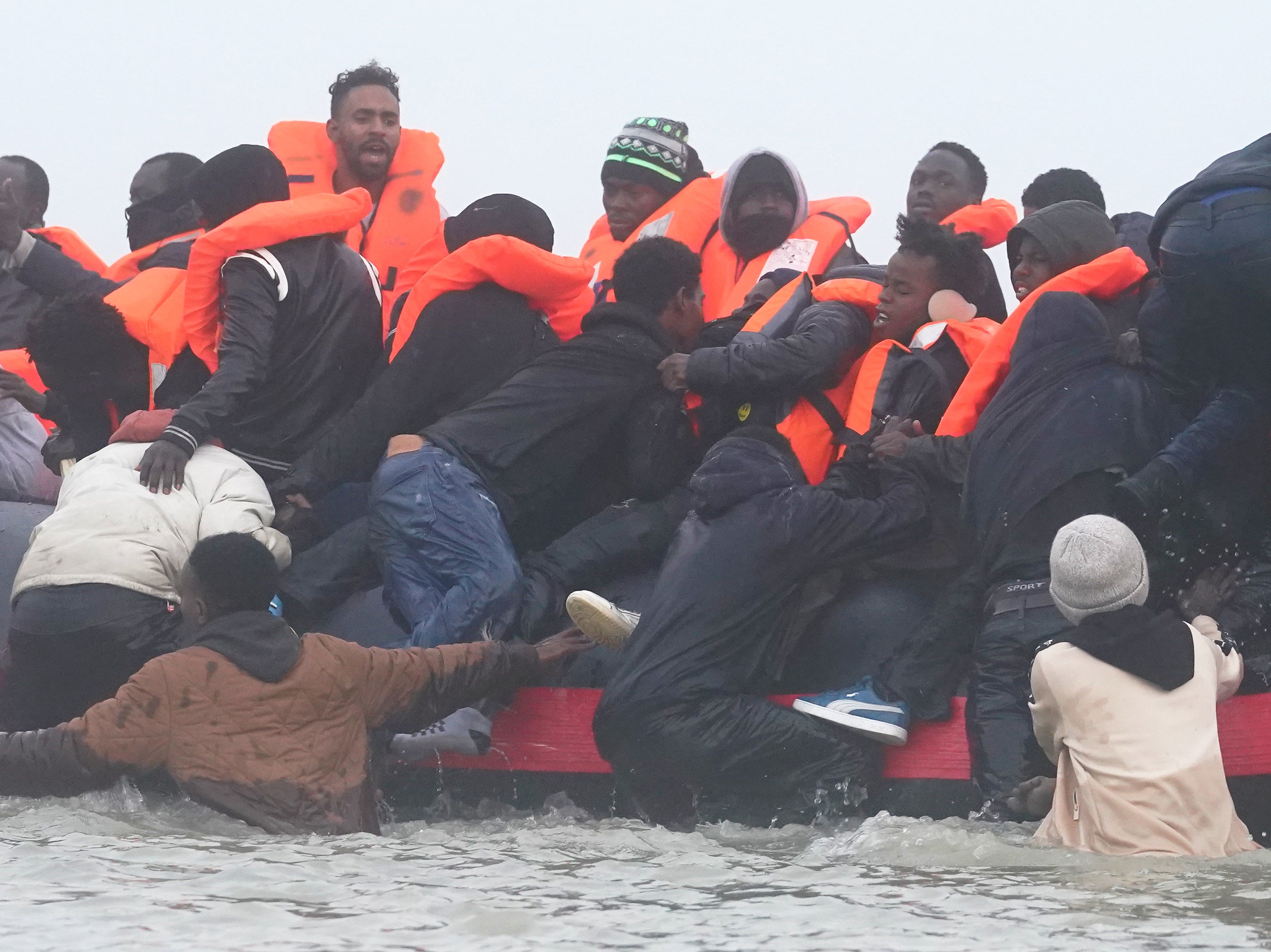 <p>Asylum seekers leaving Gravelines in northern France</p>