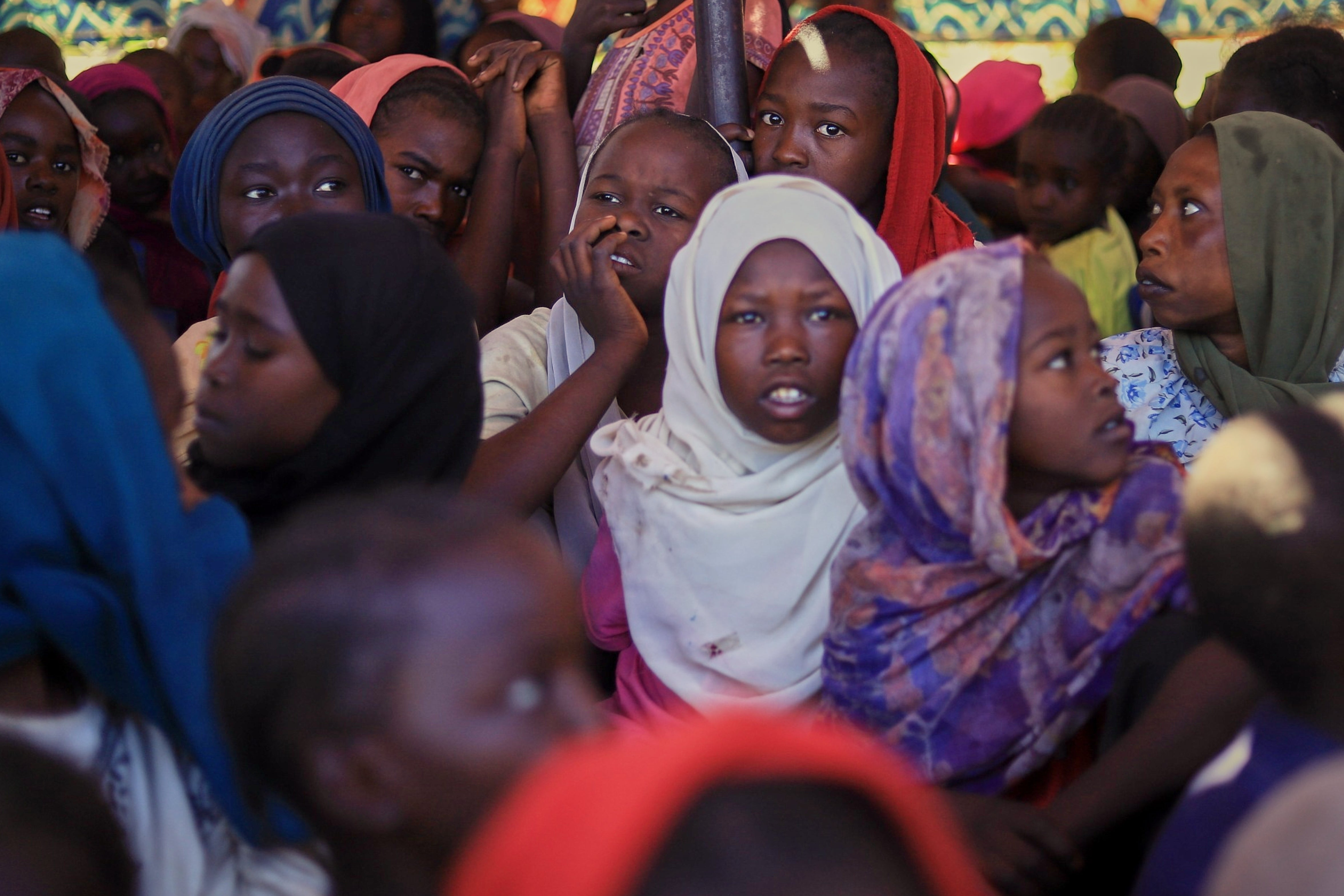 <p>Displaced women and children from el-Fasher at a refugee camp in Tawila</p>