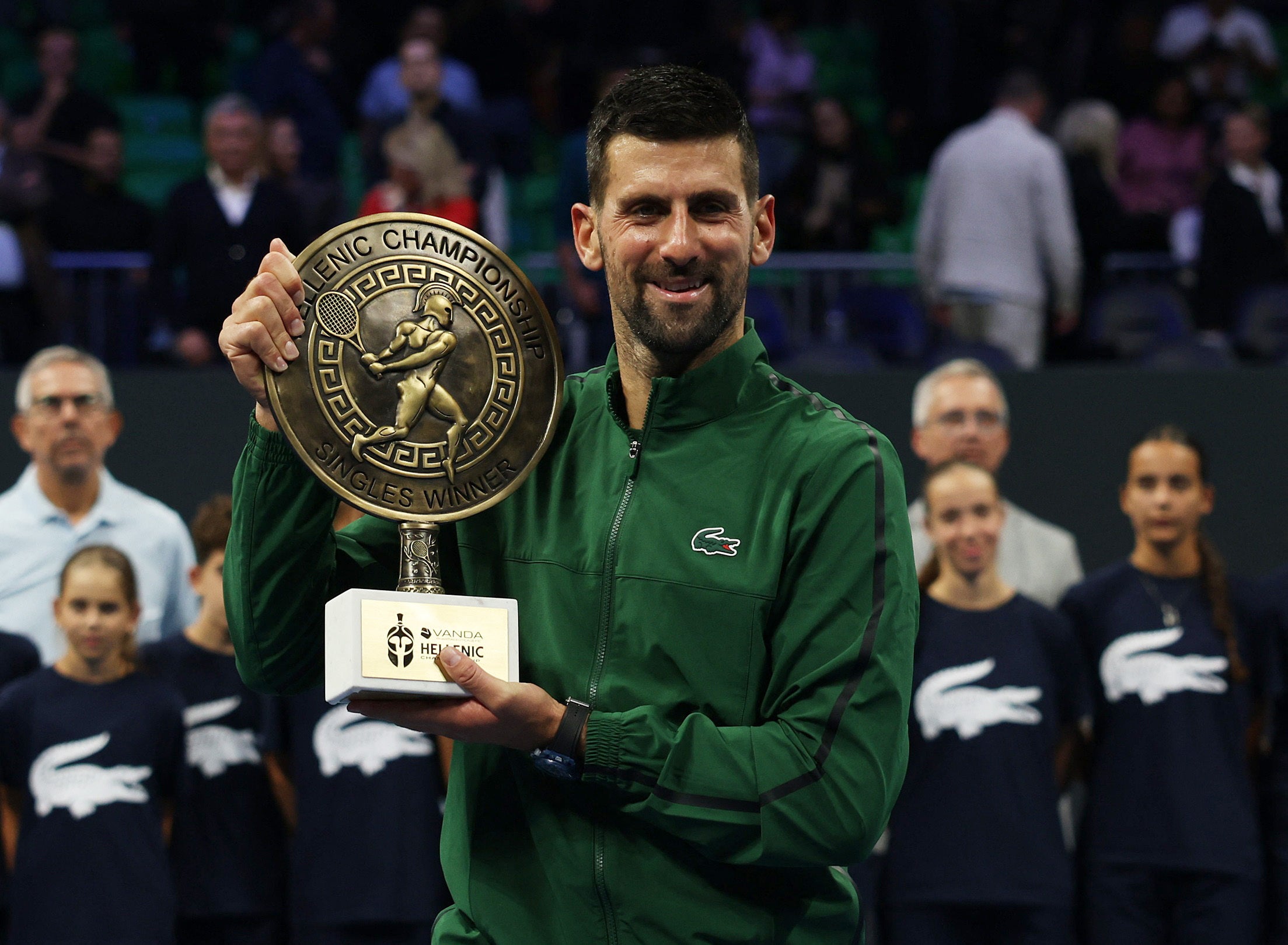 Djokovic celebrates with the trophy