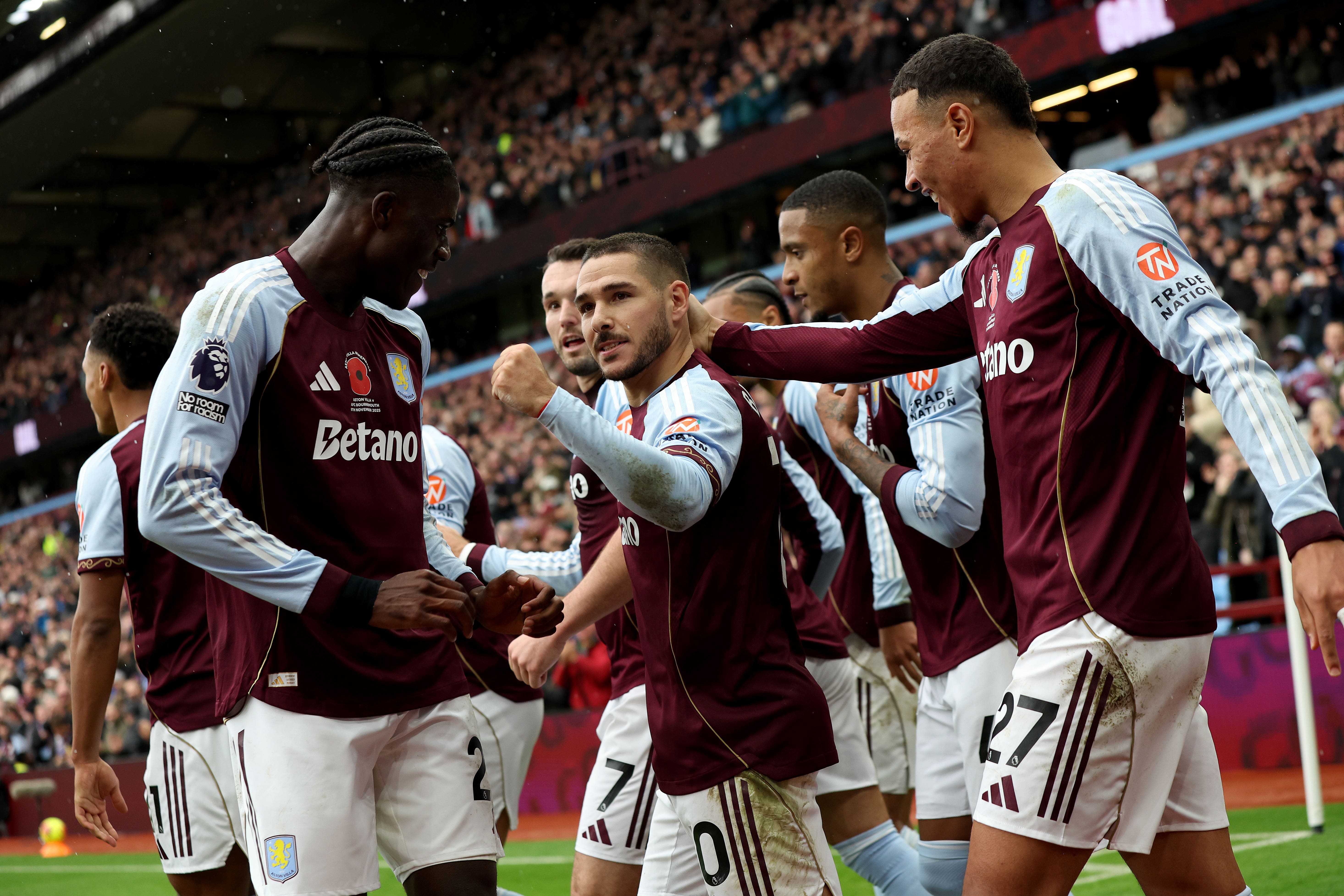 Emiliano Buendia (centre) celebrates firing Aston Villa ahead in their 4-0 win over Bournemouth (Barrington Combs/PA).